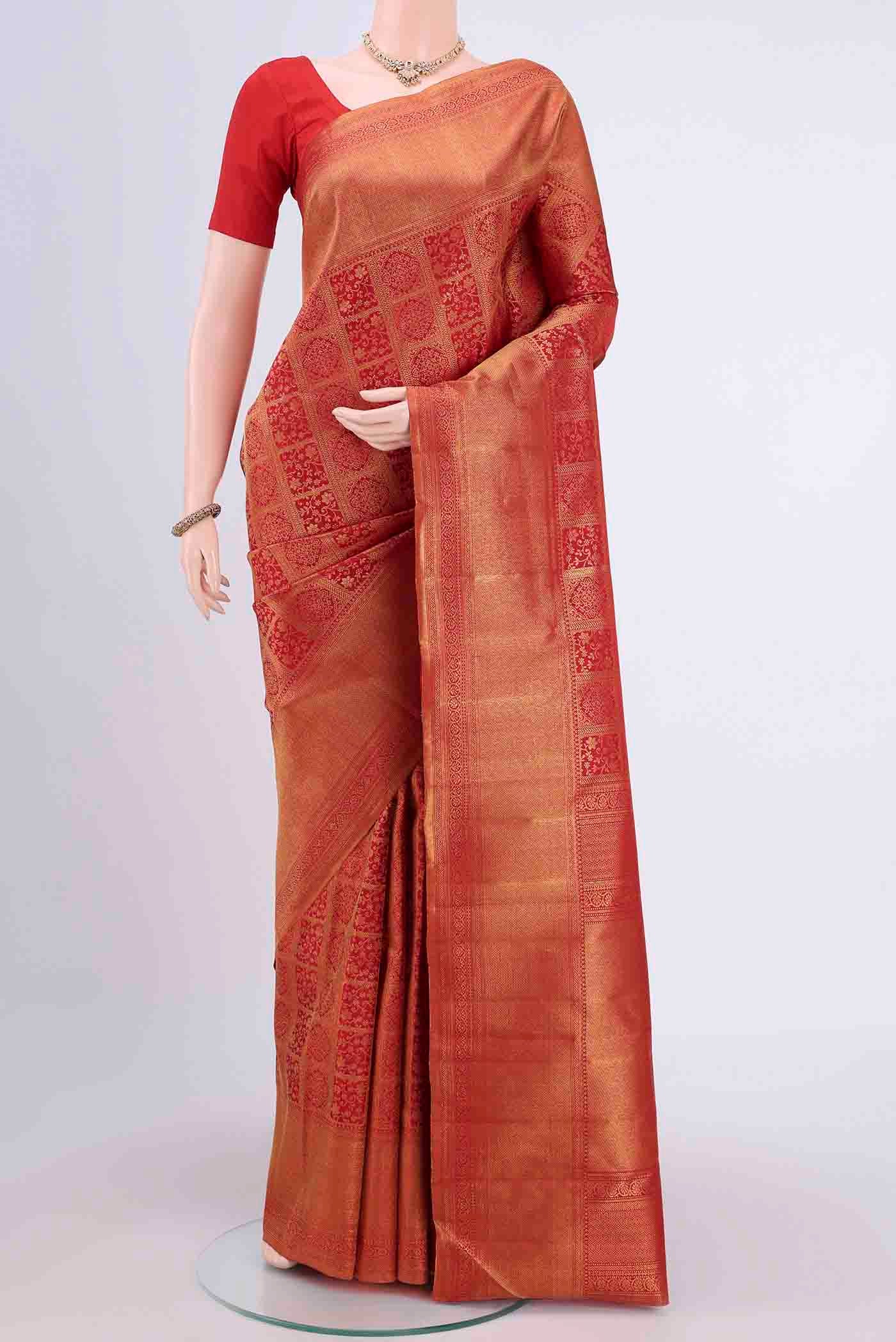 Red Dual Tone Kanchipuram Saree with Zari Brocade on the body and Zari Border displayed on a mannequin