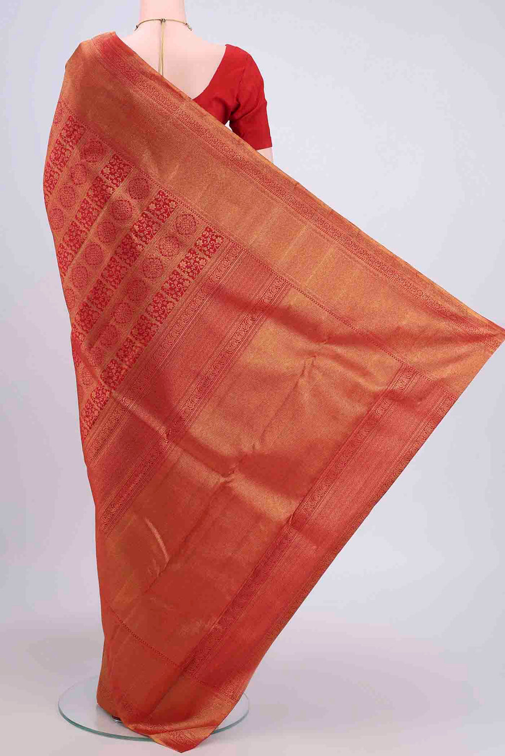 Flat view of Red Dual Tone Kanchipuram Saree with Zari Brocade on the body and Zari Border