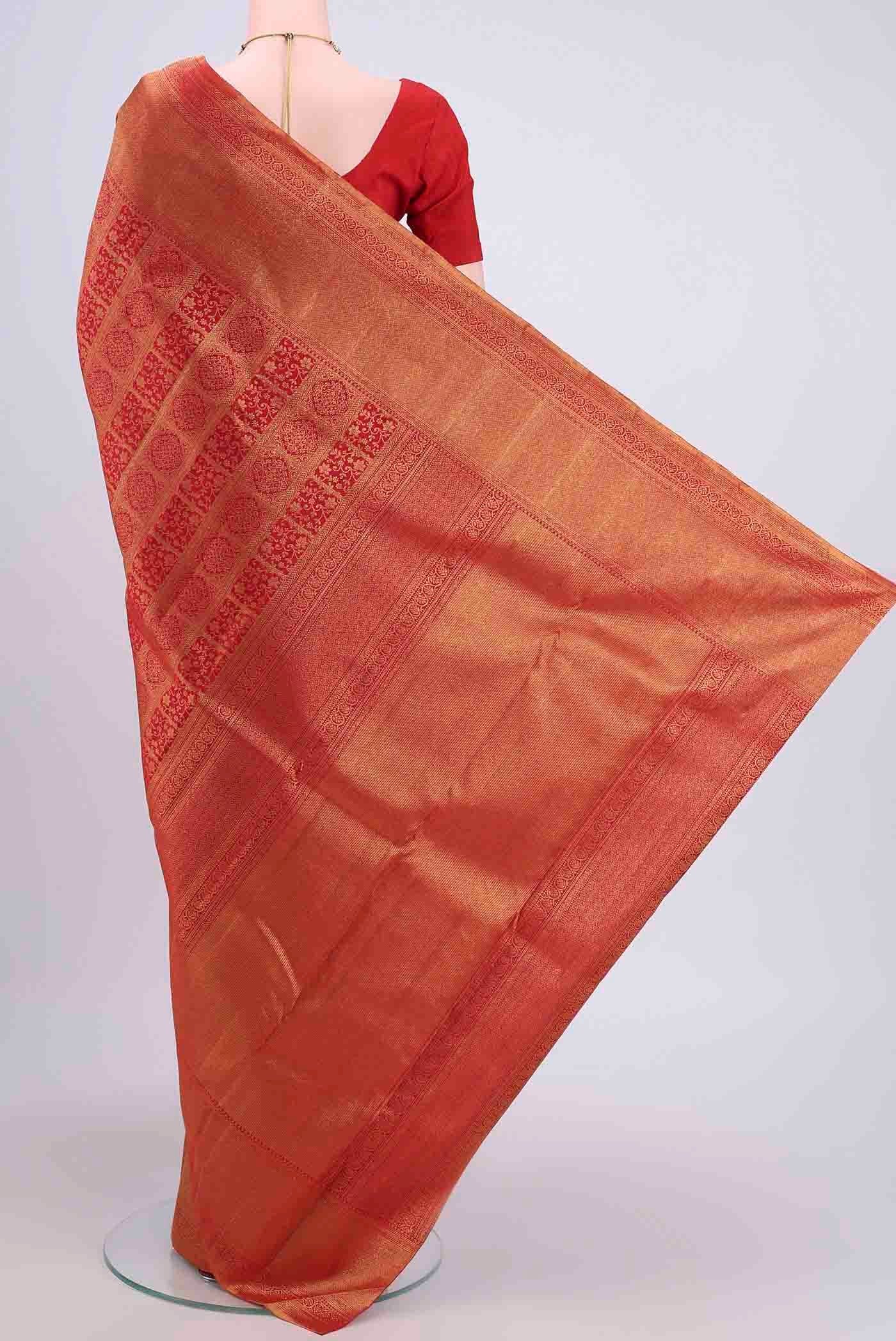 Flat view of Red Dual Tone Kanchipuram Saree with Zari Brocade on the body and Zari Border