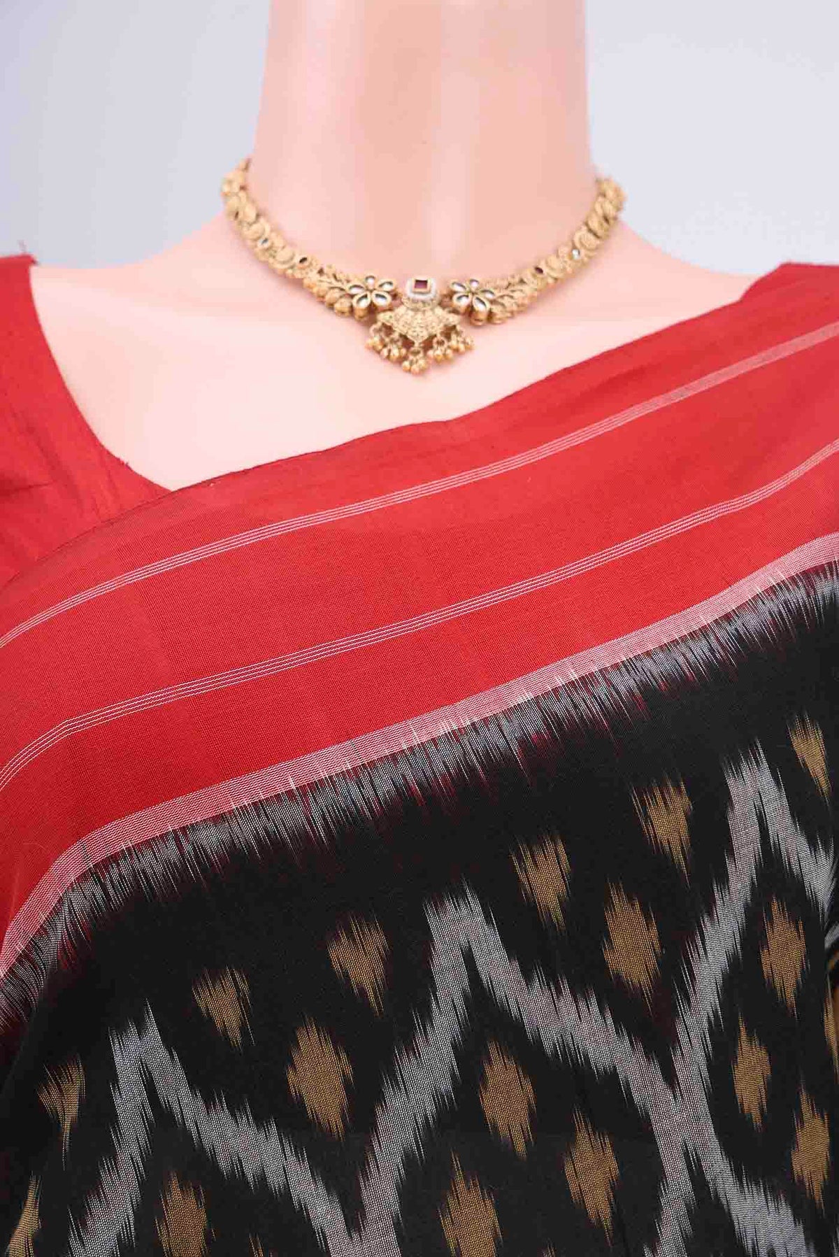 Border image of Black Pochampally Cotton Saree with Ikat design on the body and Ikat Border. 