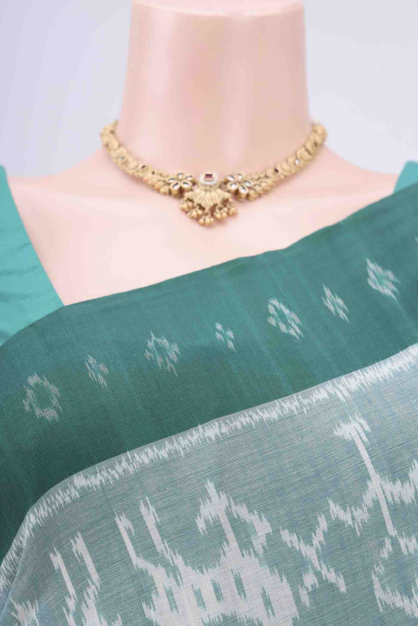 Border image of Sea Green Pochampally Cotton Saree with Ikat design on the body and Ikat Border. 