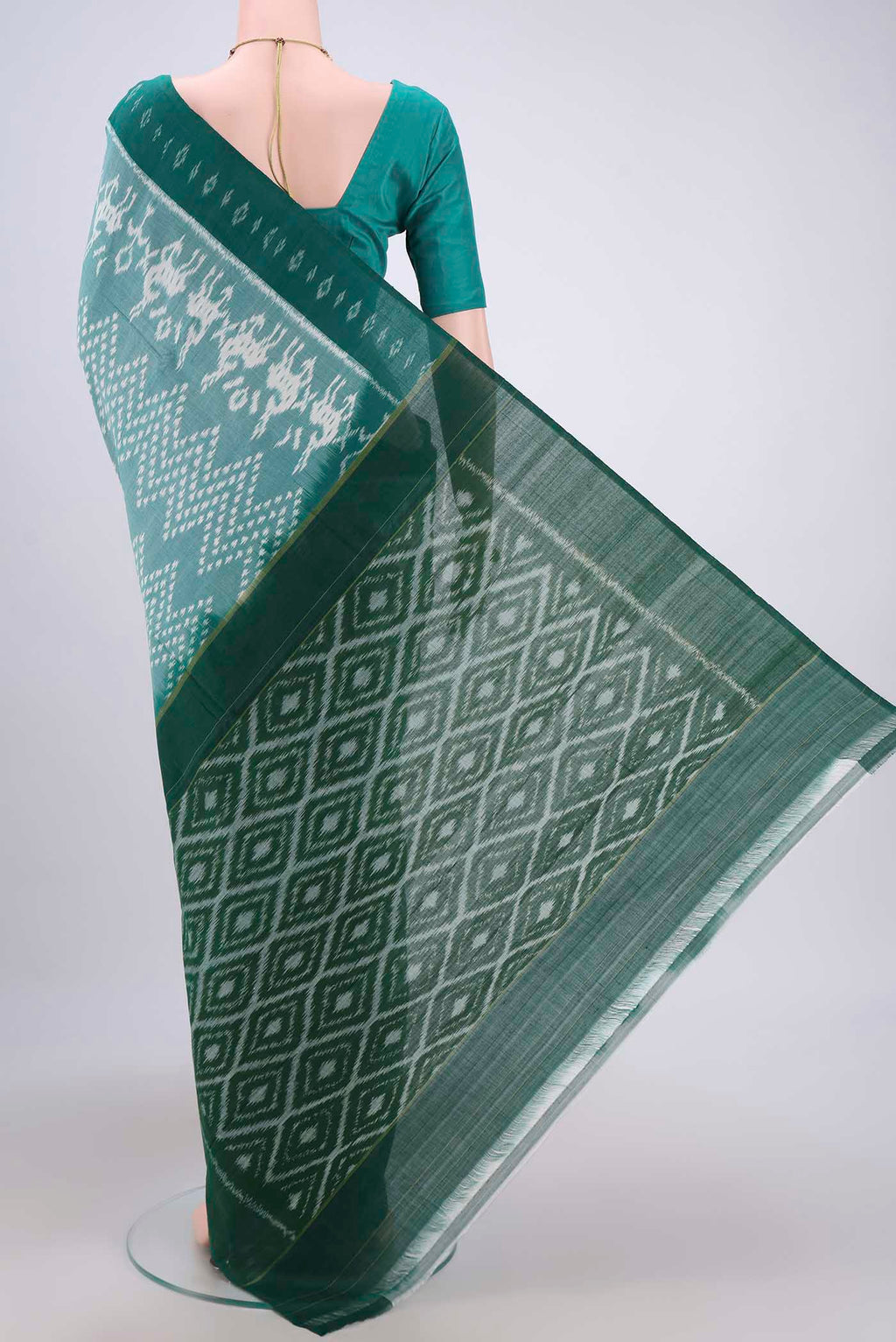 Flat view of Sea Green Pochampally Cotton Saree with Ikat design on the body and Ikat Border. 