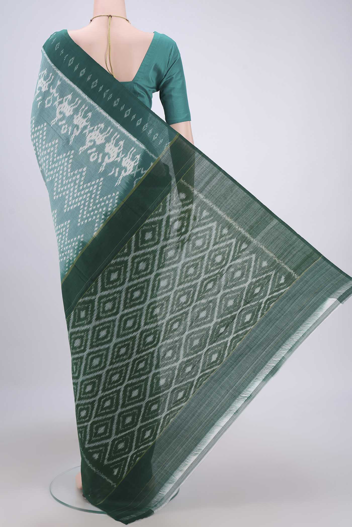 Flat view of Sea Green Pochampally Cotton Saree with Ikat design on the body and Ikat Border. 