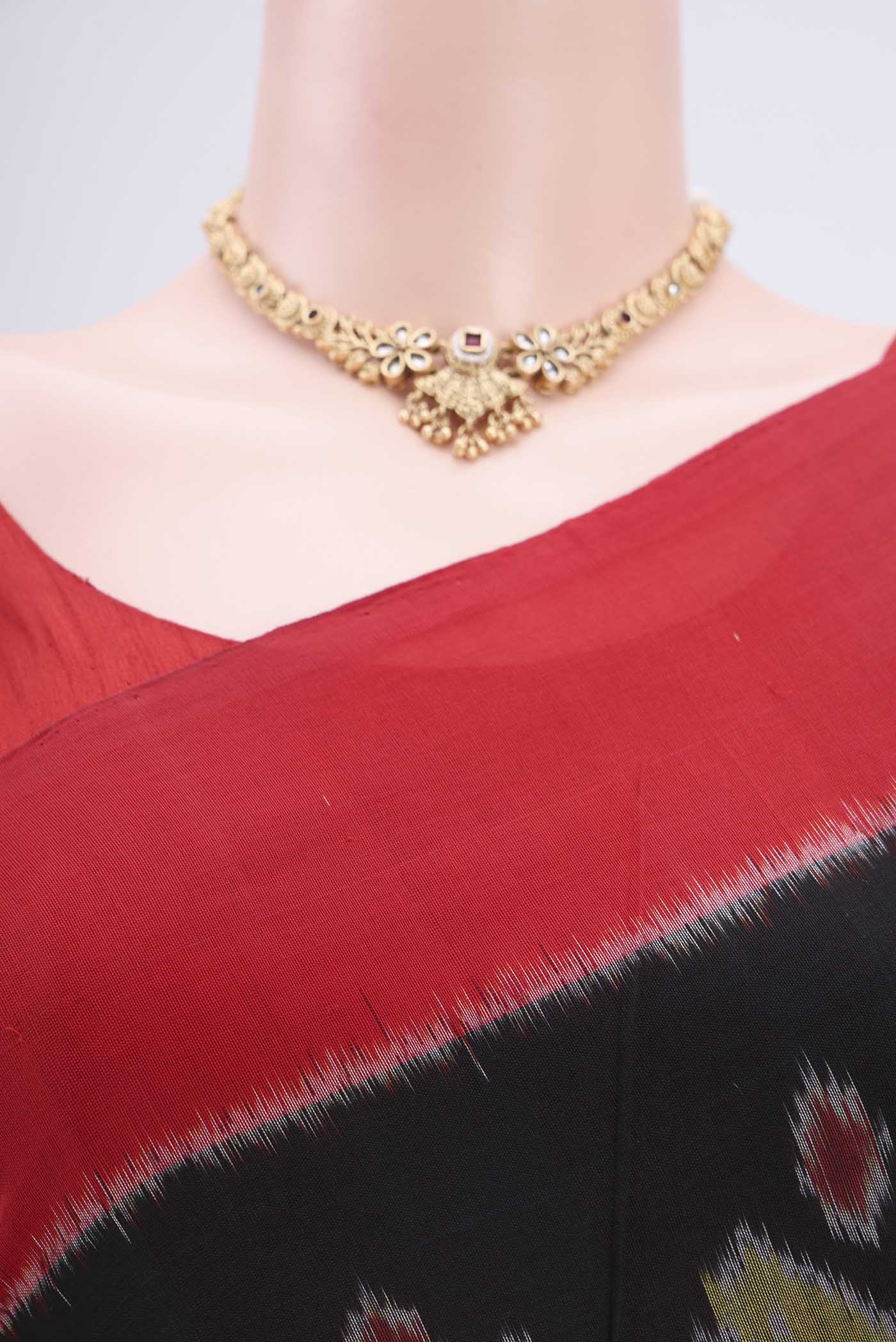 Border image of Black Pochampally Cotton Saree with Ikat design on the body and Ikat Border. 