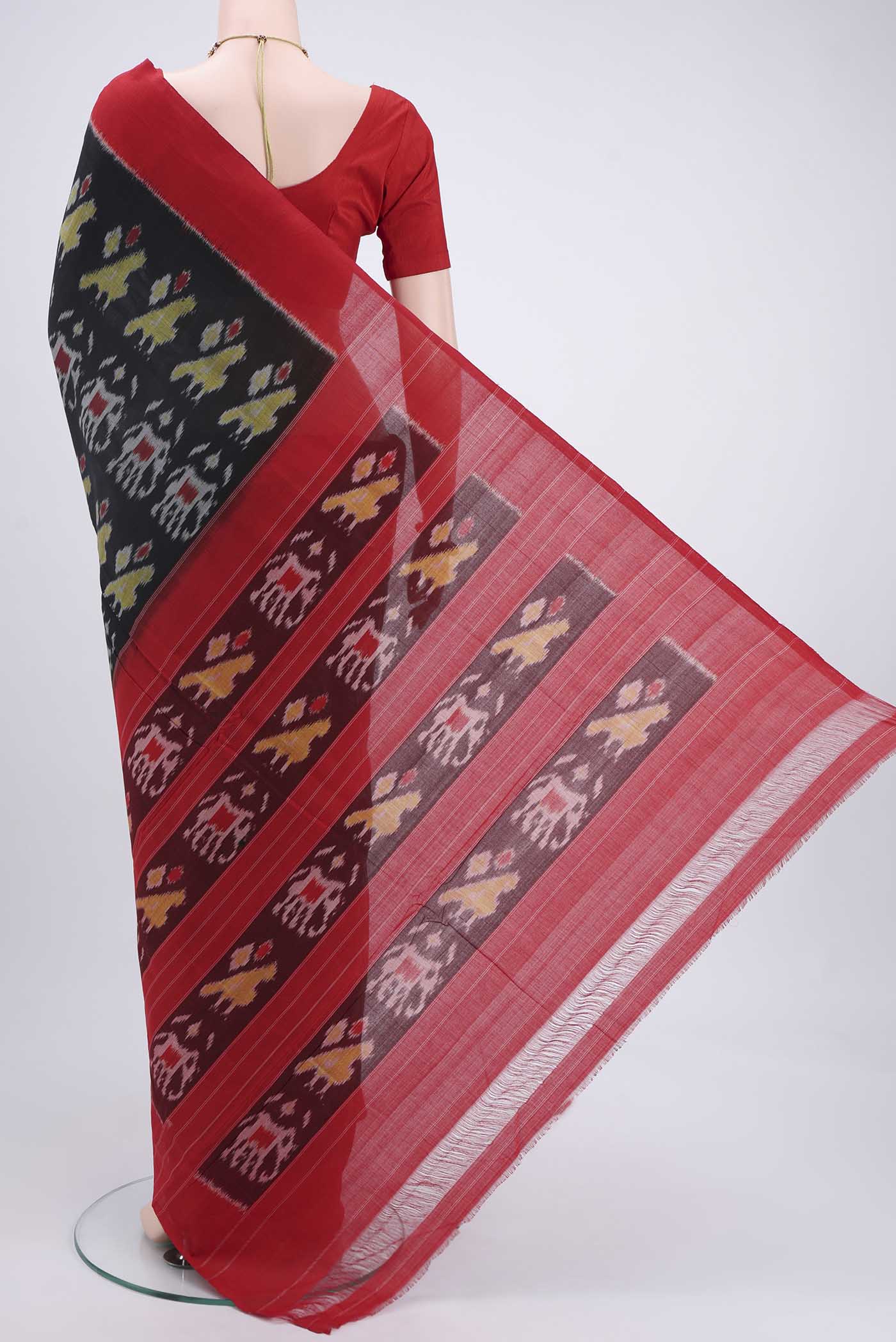 Flat view of Black Pochampally Cotton Saree with Ikat design on the body and Ikat Border. 