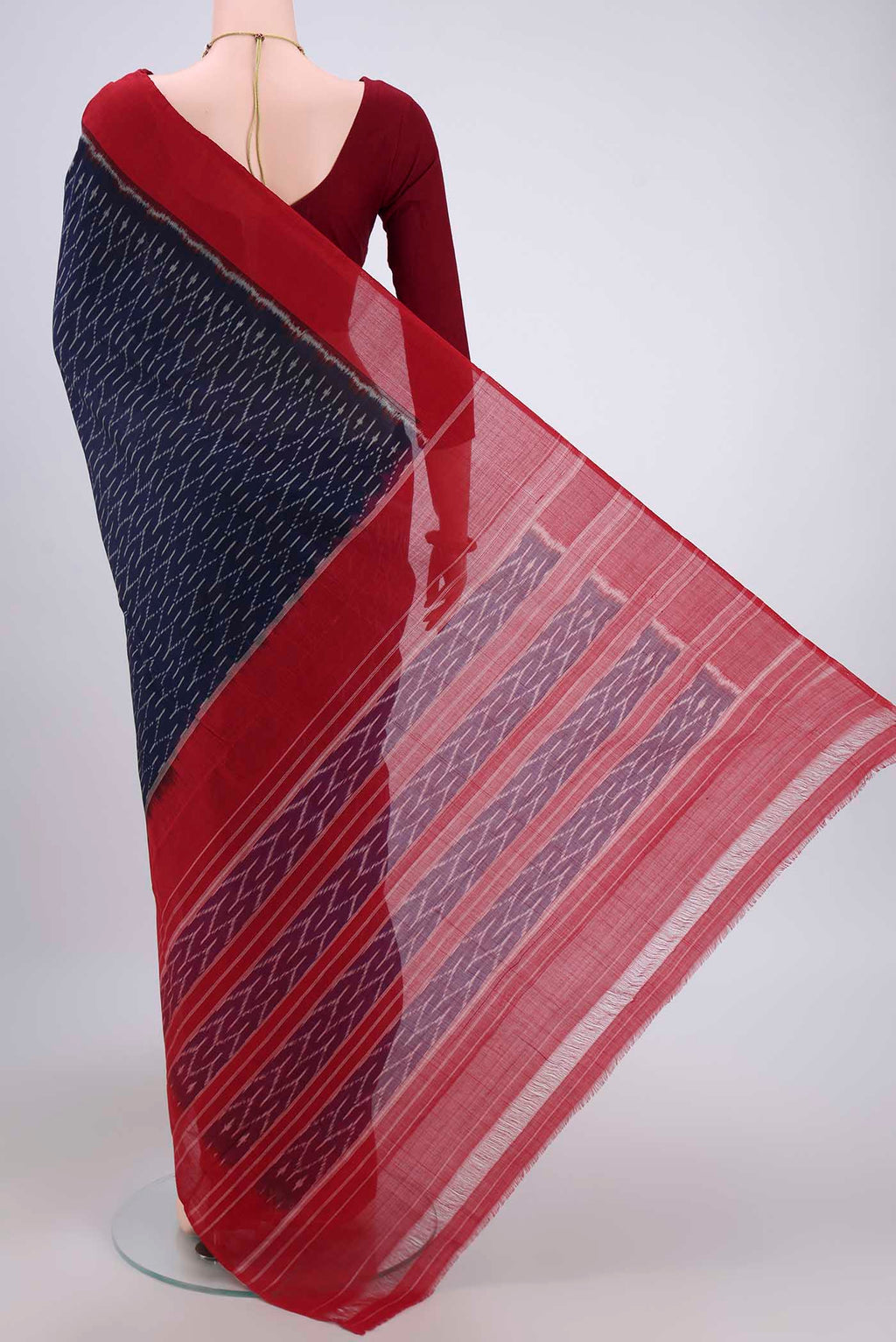 Flat view of Navy Blue Pochampally Cotton Saree with Ikat design on the body and Ikat Border. 
