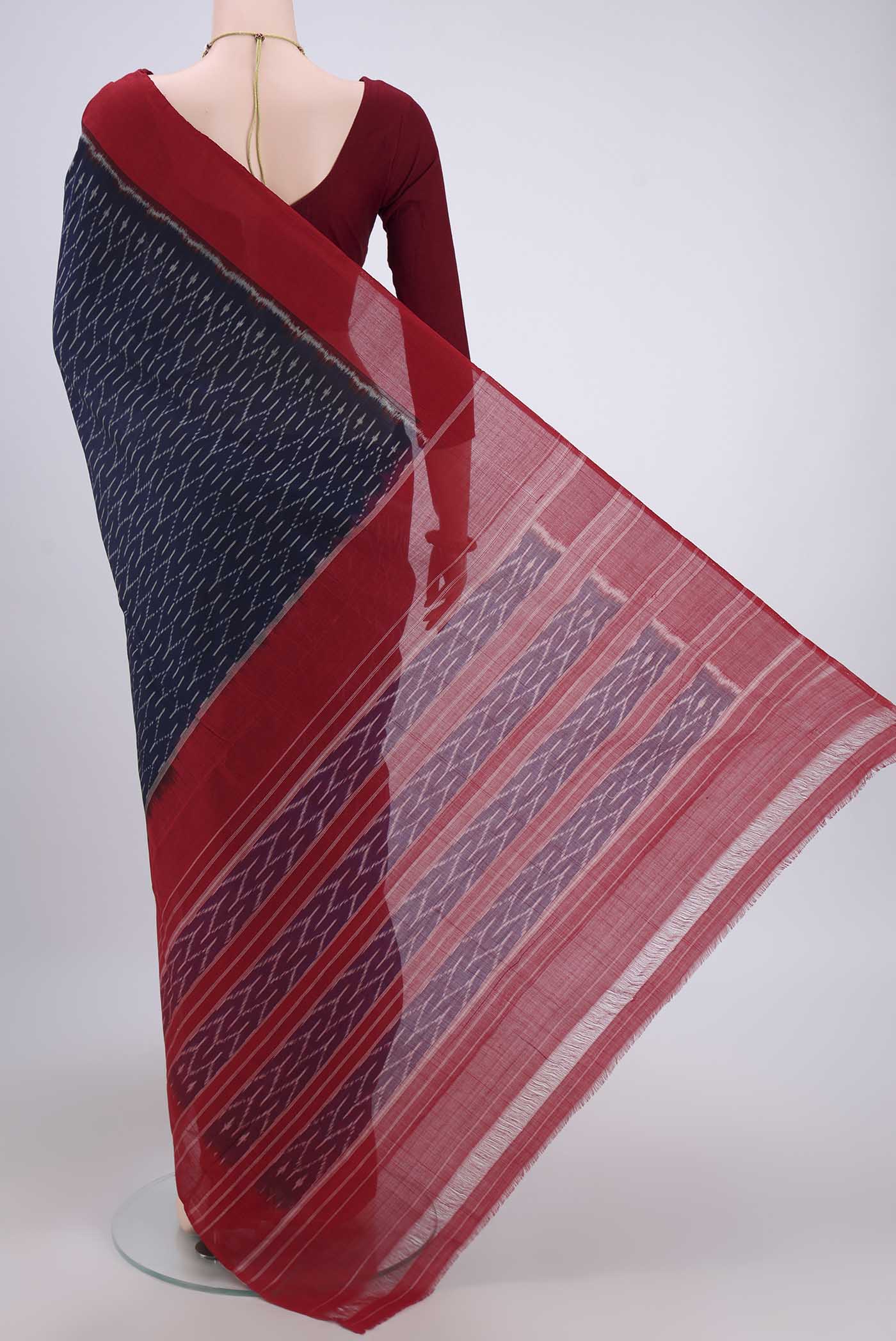 Flat view of Navy Blue Pochampally Cotton Saree with Ikat design on the body and Ikat Border. 