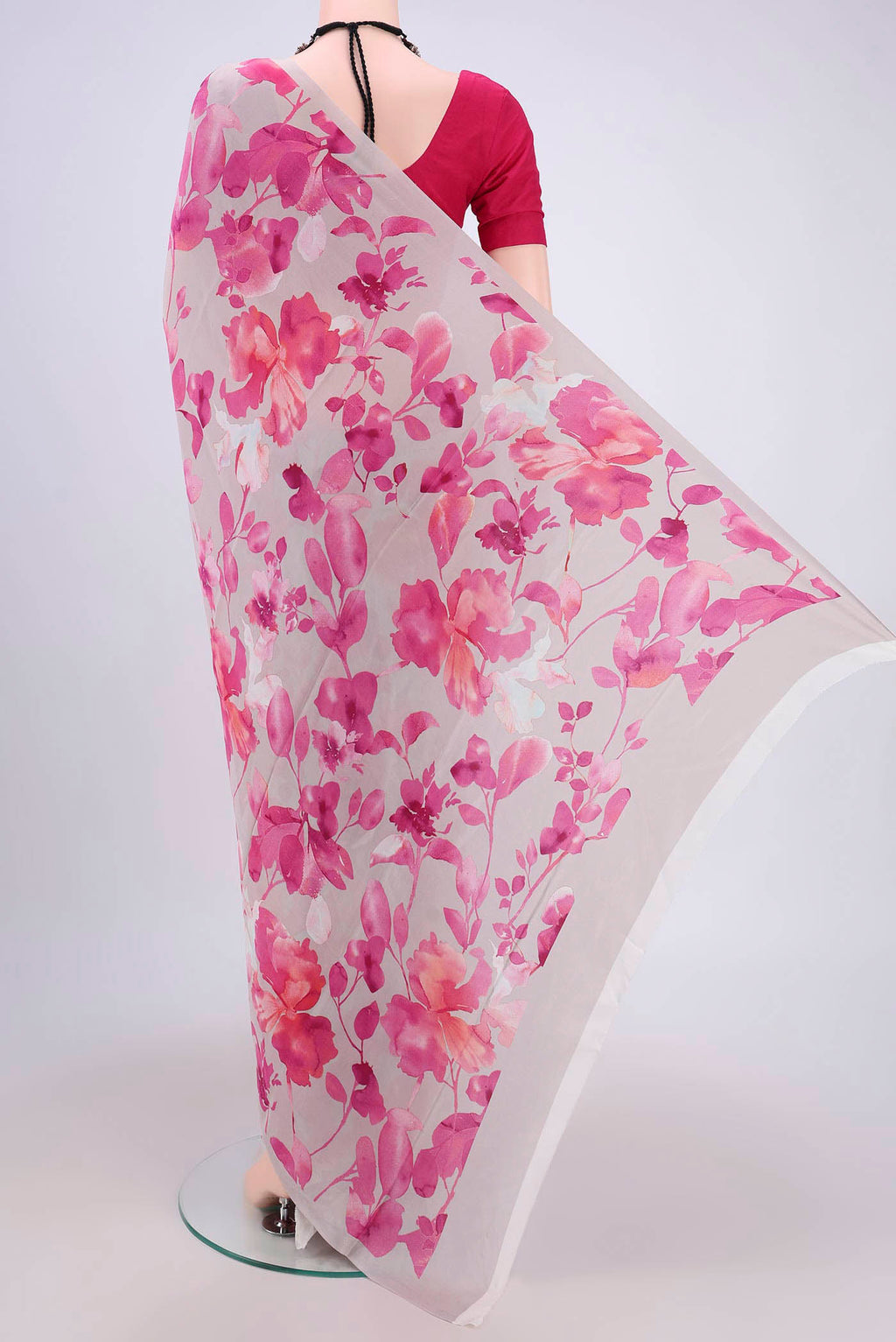 Flat view of Grey Crepe Saree with Floral Print on the body and Plain Border. 