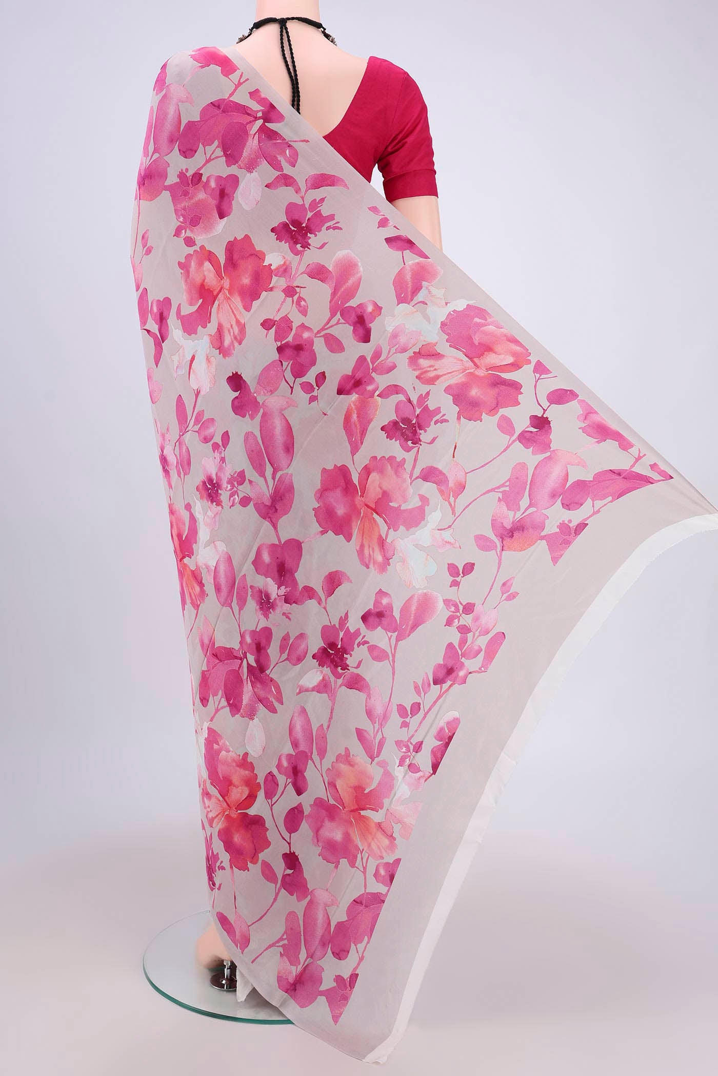 Flat view of Grey Crepe Saree with Floral Print on the body and Plain Border. 