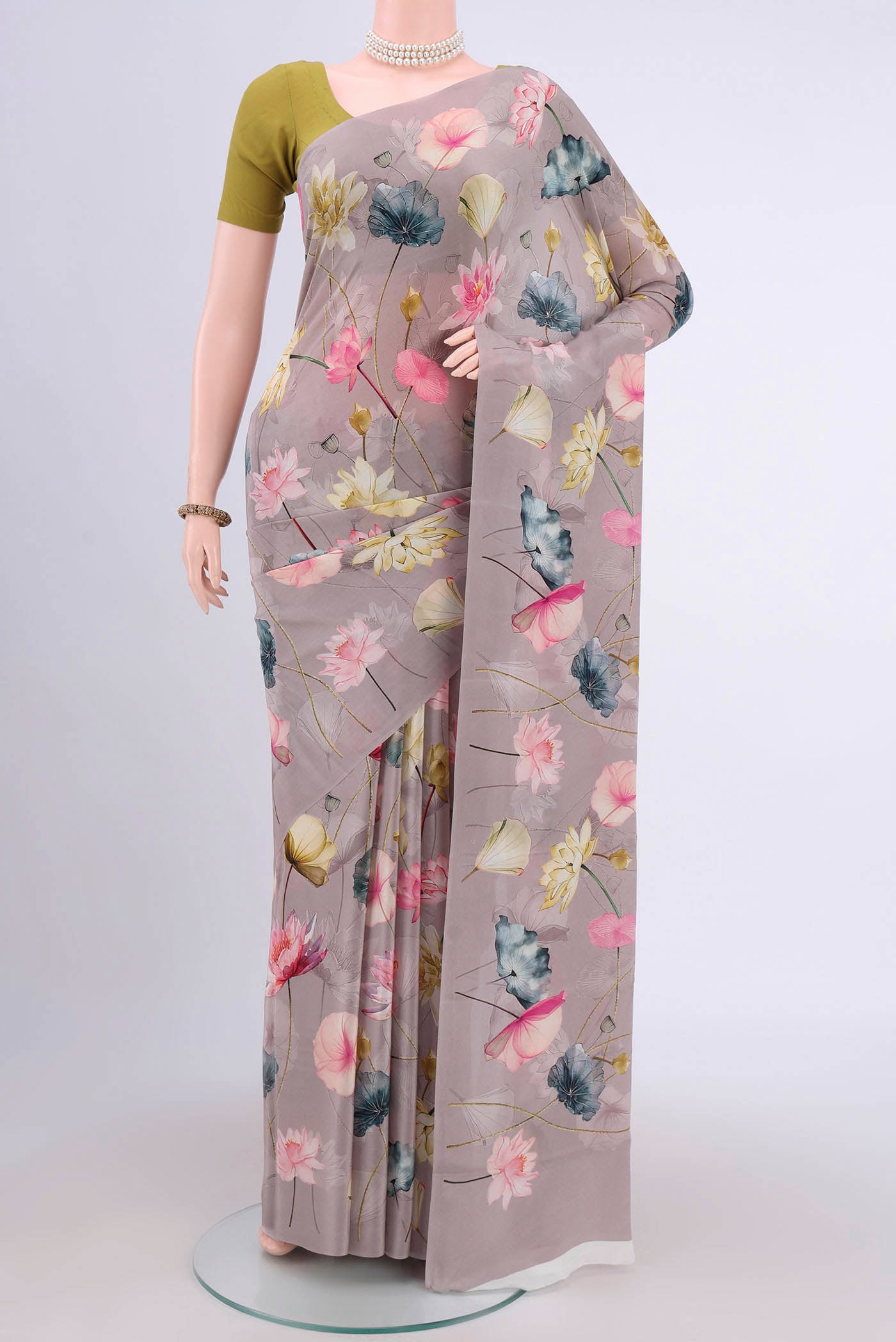 Davys Grey Crepe Saree with Floral Print on the body and Plain Border.  displayed on a mannequin