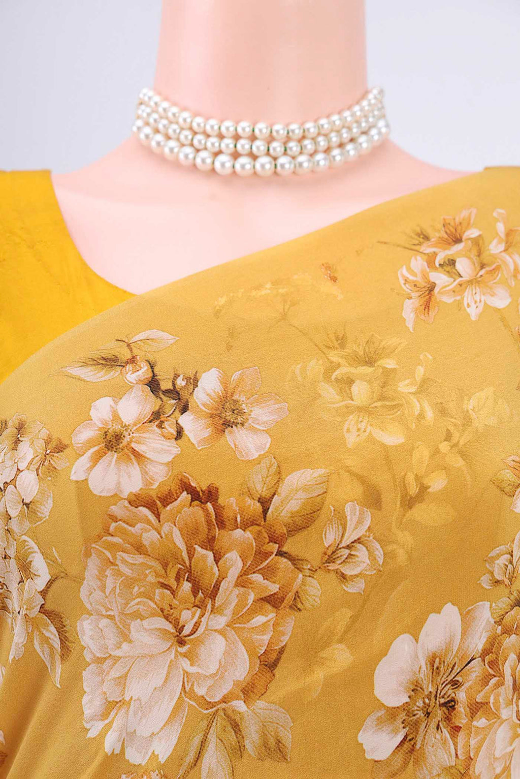 Border image of Mustard Crepe Saree with Floral Print on the body and Plain Border. 