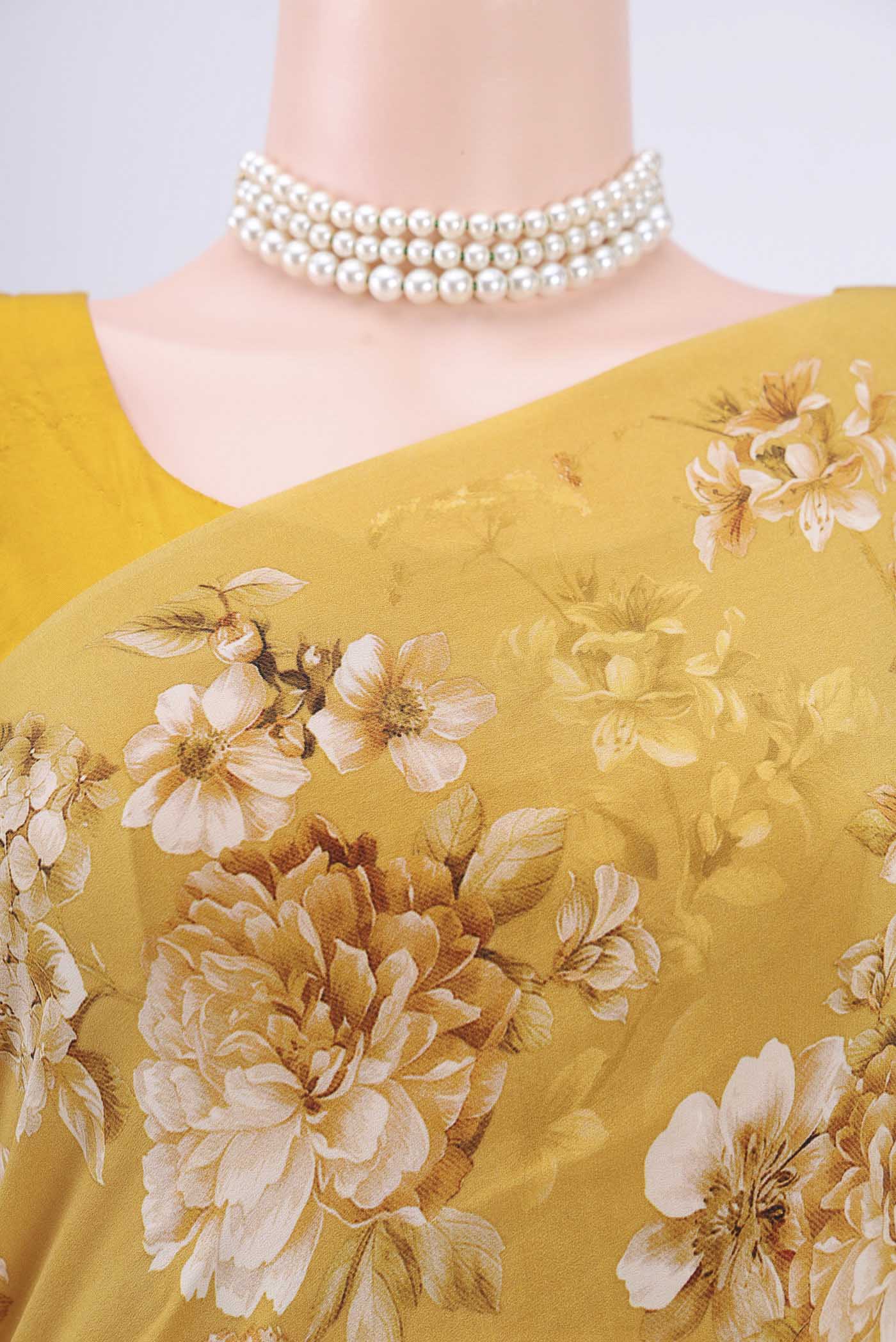 Border image of Mustard Crepe Saree with Floral Print on the body and Plain Border. 