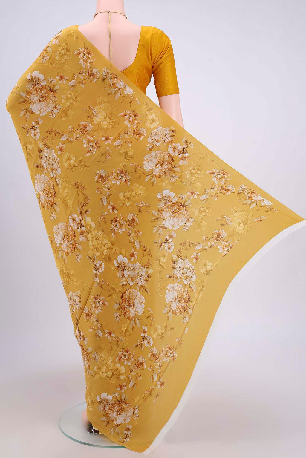 Flat view of Mustard Crepe Saree with Floral Print on the body and Plain Border. 