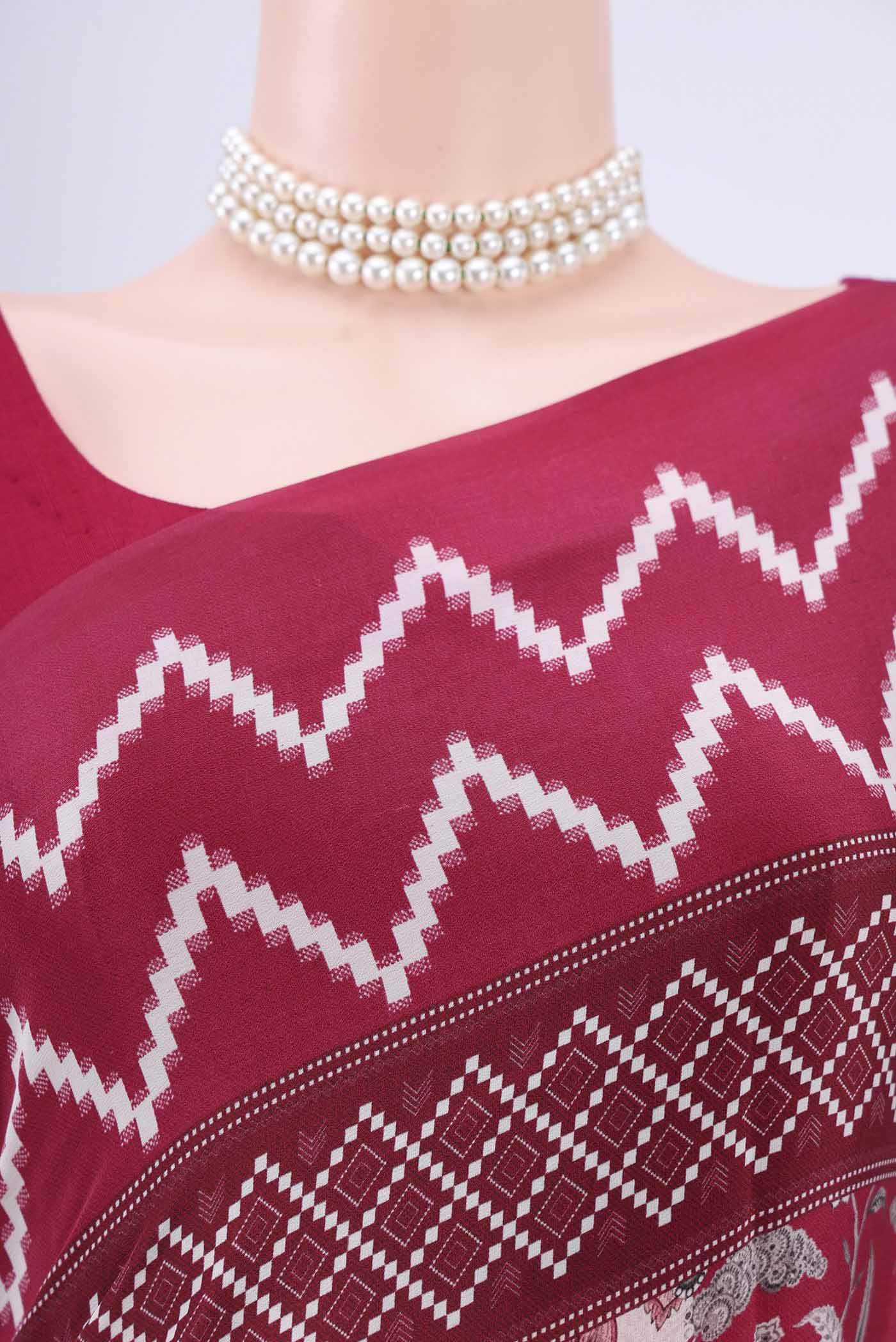 Border image of Maroon Crepe Saree with Floral Print on the body and Plain Border. 