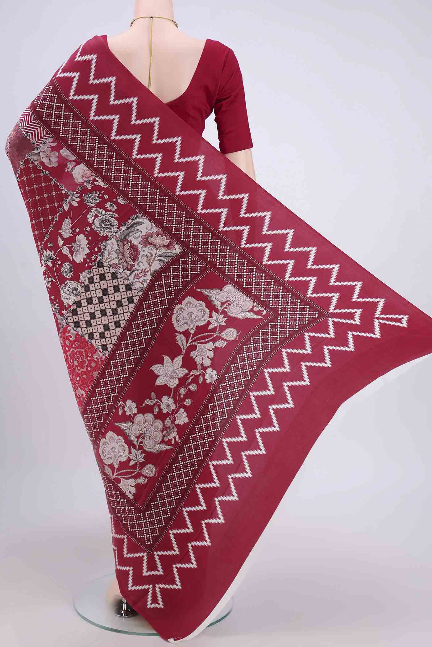 Flat view of Maroon Crepe Saree with Floral Print on the body and Plain Border. 