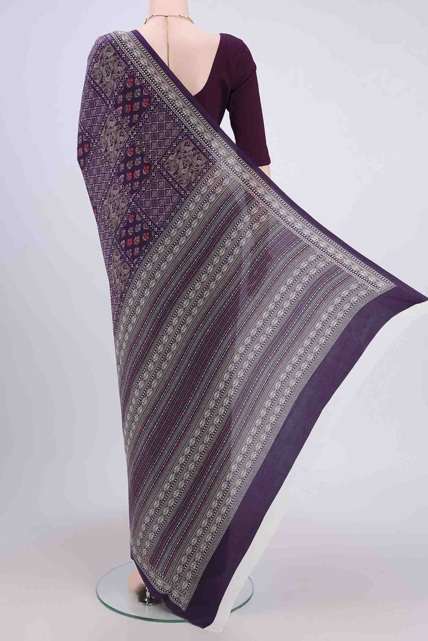 Flat view of Purple Crepe Saree with Floral Print on the body and Plain Border. 