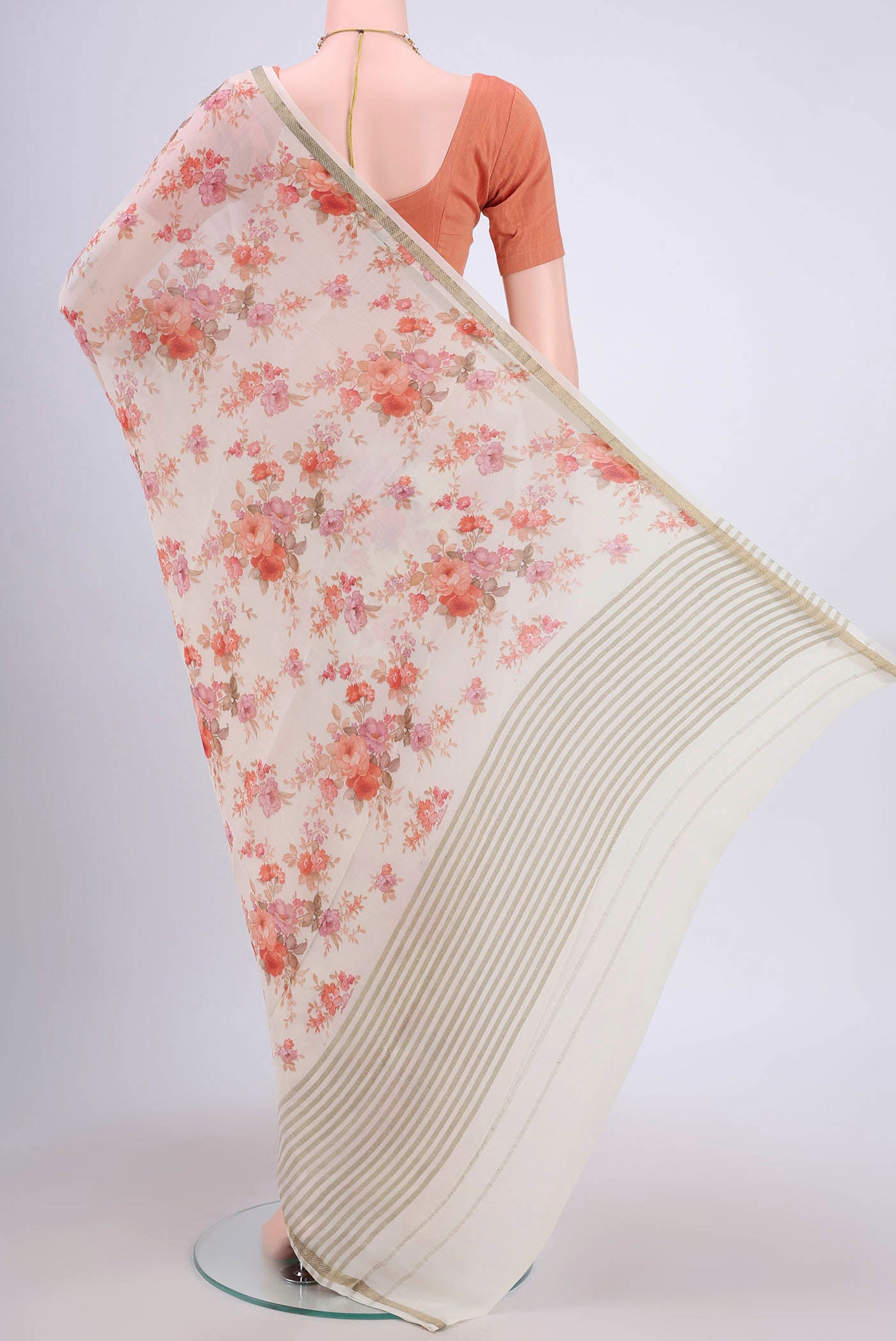 Flat view of Off White Mysore Crepe Saree with Floral Print on the body and Printed Border. 