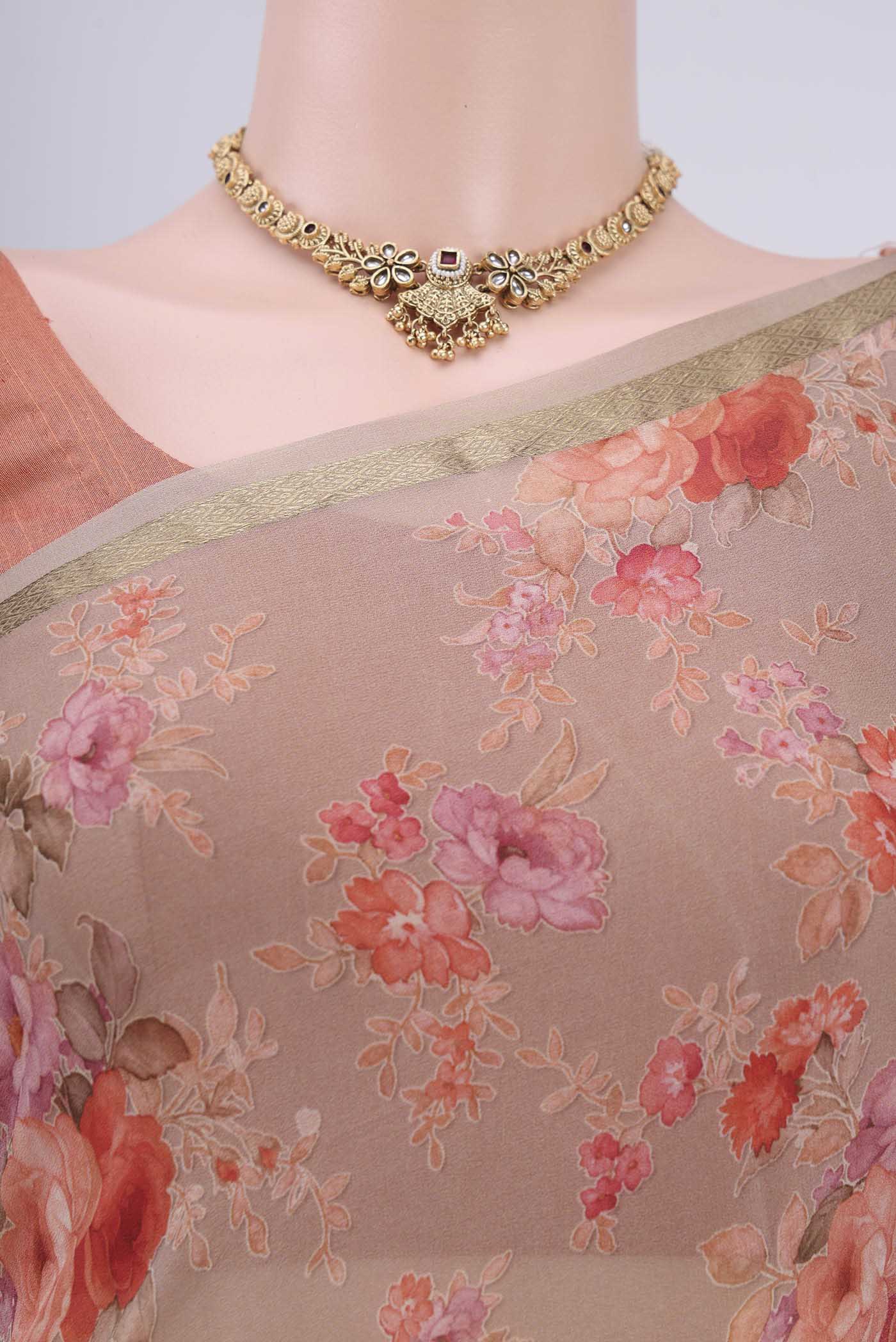 Border image of Dark Beige Crepe Saree with Floral Print on the body and Zari Border. 