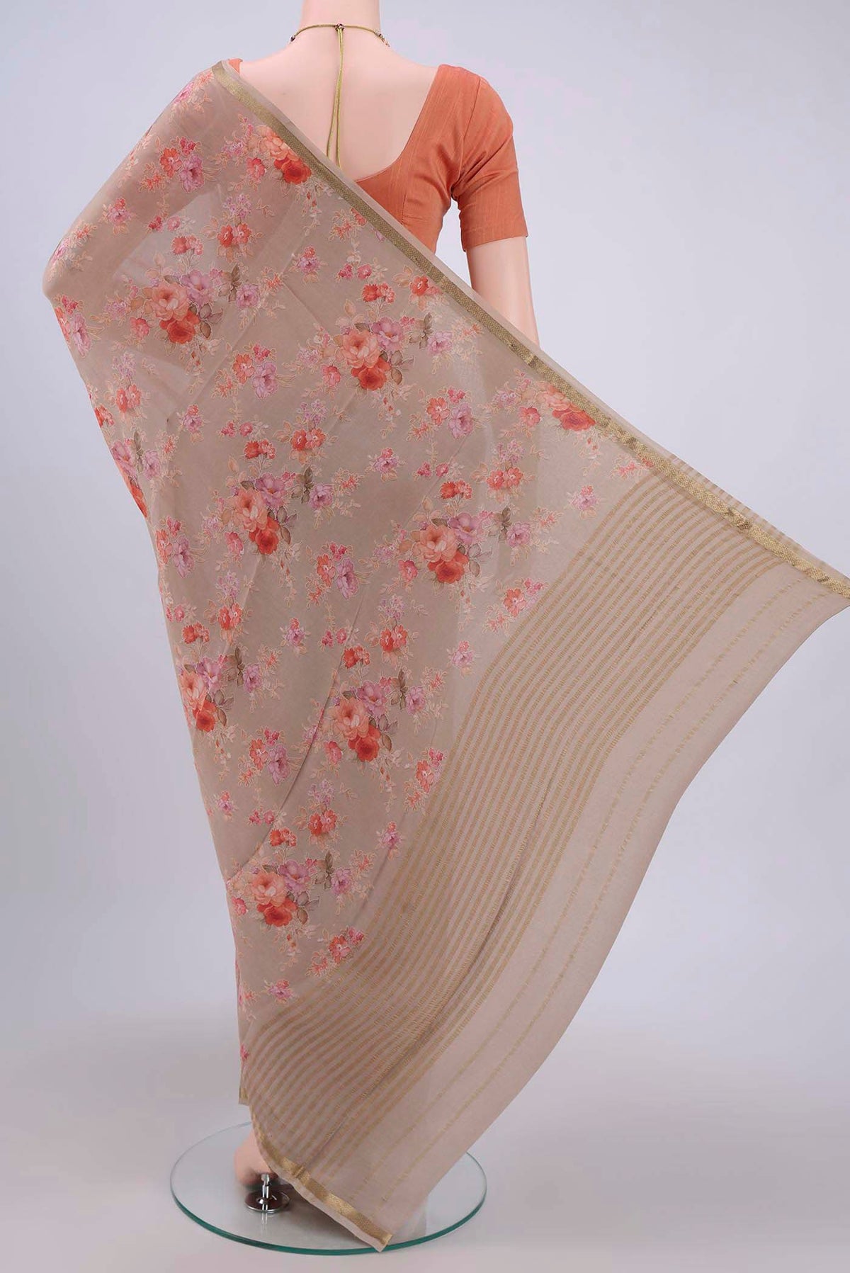 Flat view of Dark Beige Crepe Saree with Floral Print on the body and Zari Border. 