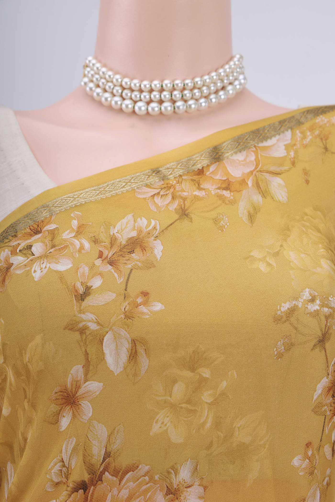 Border image of Mustard Crepe Saree with Floral Print on the body and Zari Border. 