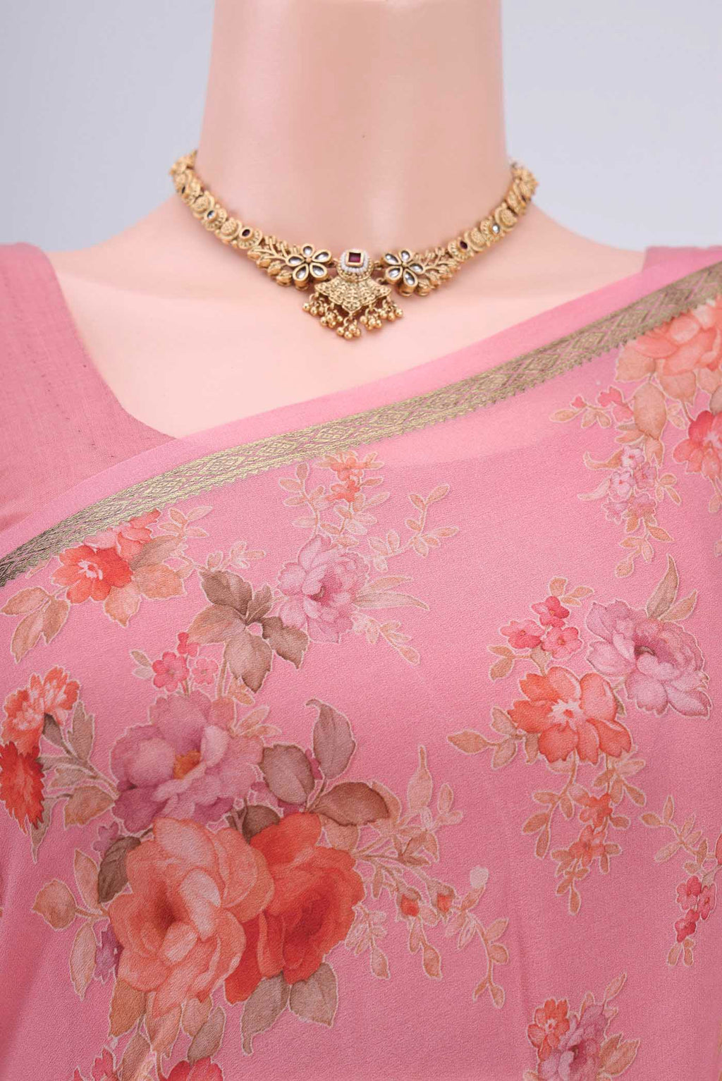 Border image of Peach Crepe Saree with Floral Print on the body and Plain Border. 