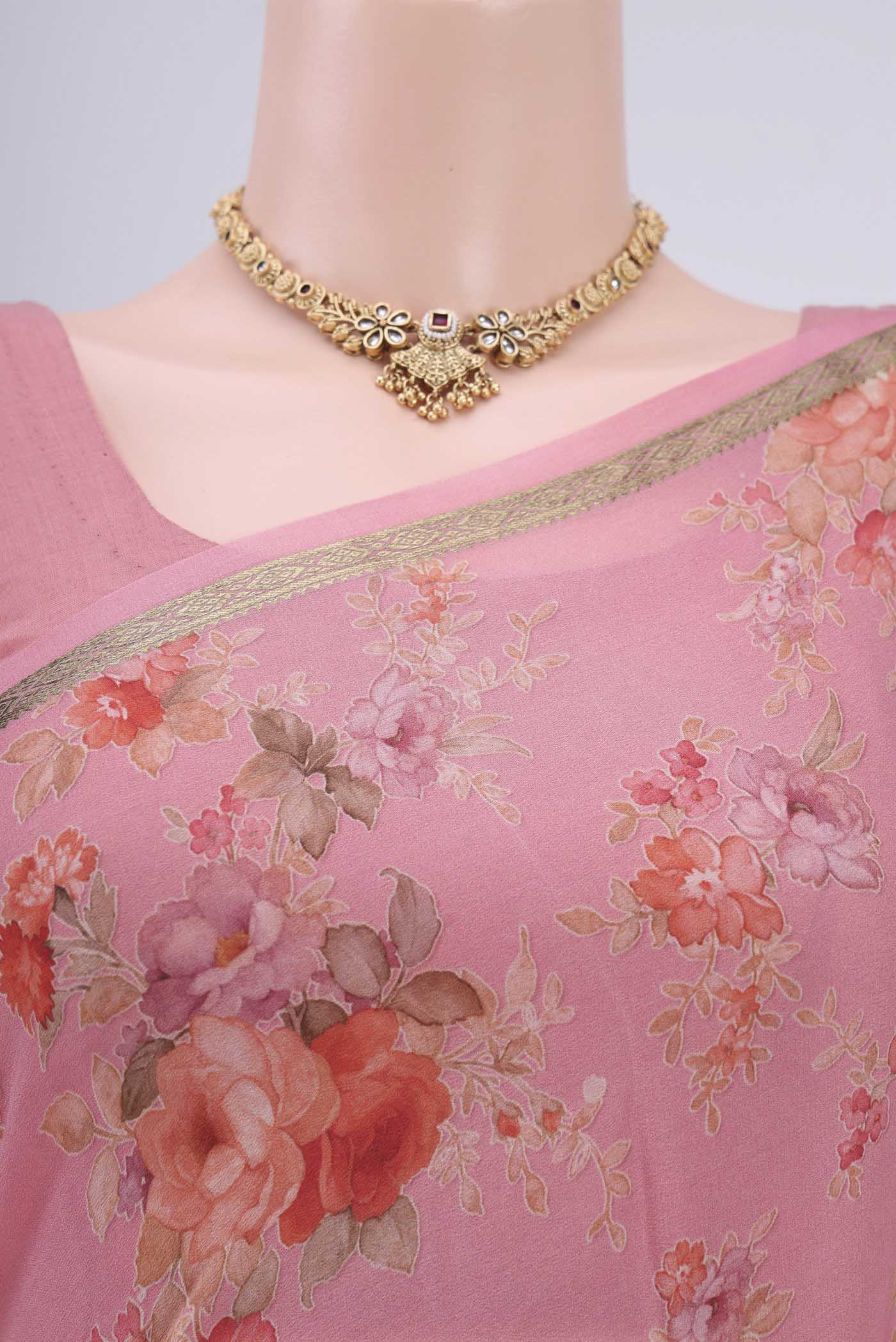 Border image of Peach Crepe Saree with Floral Print on the body and Plain Border. 