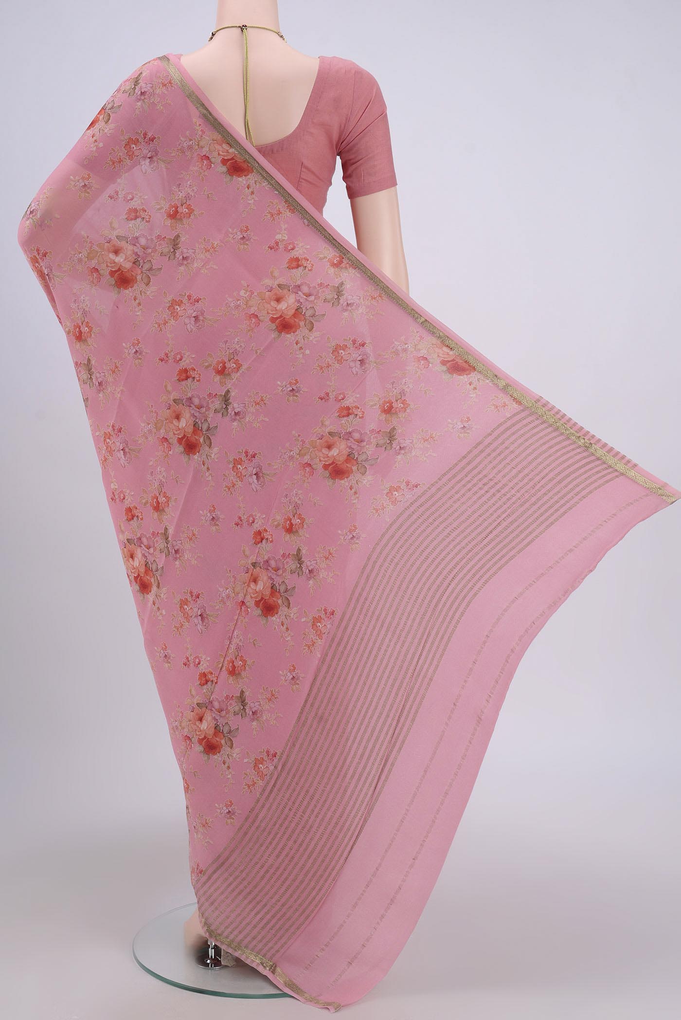 Flat view of Peach Crepe Saree with Floral Print on the body and Plain Border. 