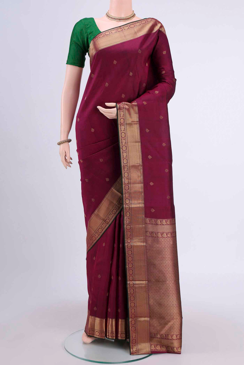 Magenta Dual Tone Nangavalli Silk [ Salem ] Saree with Zari Butta on the body and Zari Border displayed on a mannequin
