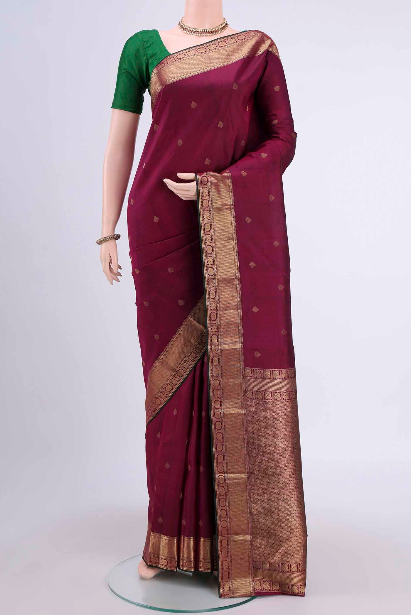 Magenta Dual Tone Nangavalli Silk [ Salem ] Saree with Zari Butta on the body and Zari Border displayed on a mannequin