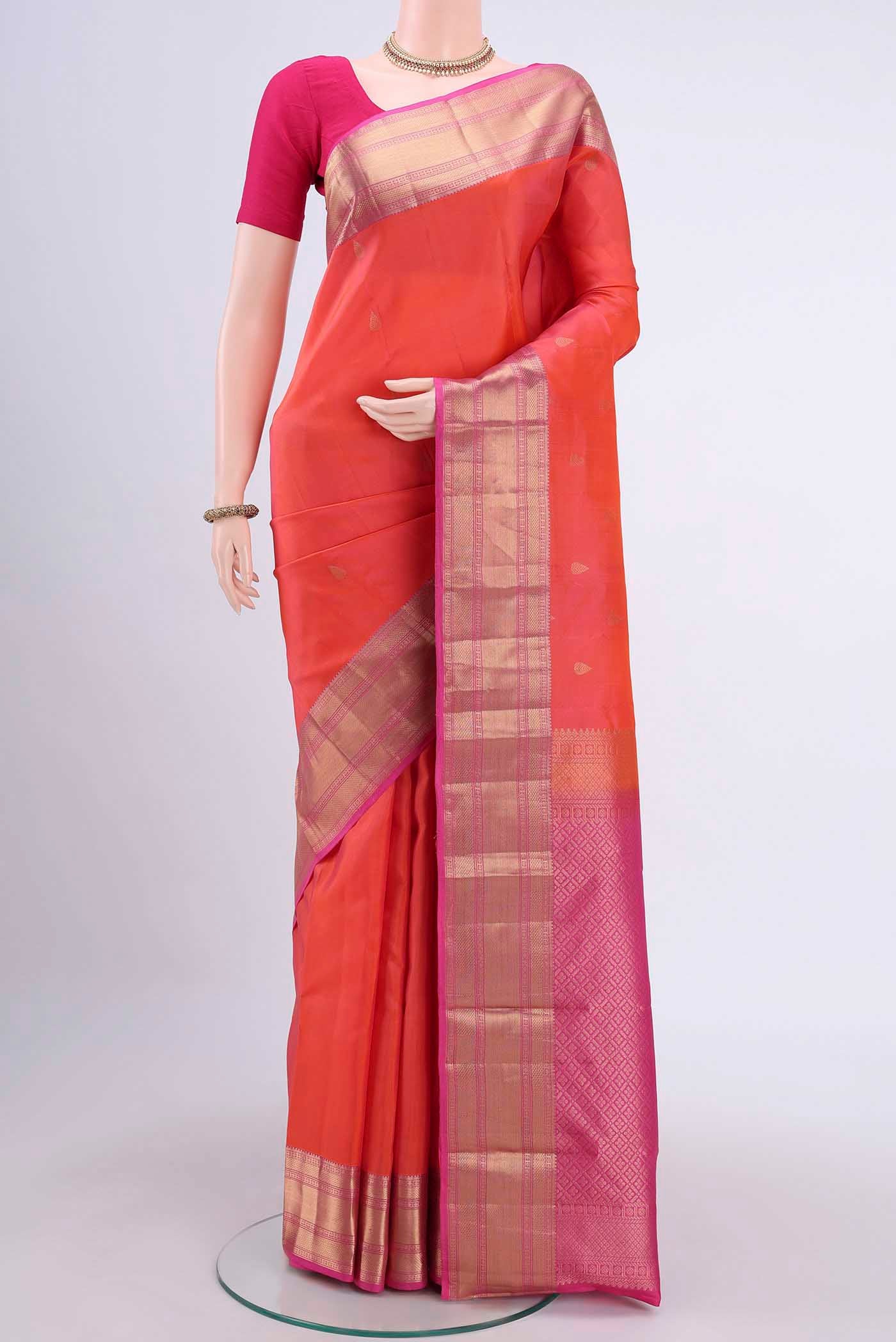 Brick Orange Dual Tone Nangavalli Silk [ Salem ] Saree with Zari Butta on the body and Zari Border displayed on a mannequin