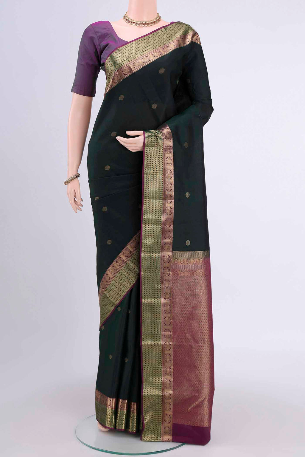 Bottle Green Dual Tone Nangavalli Silk [ Salem ] Saree with Zari Butta on the body and Zari Border displayed on a mannequin