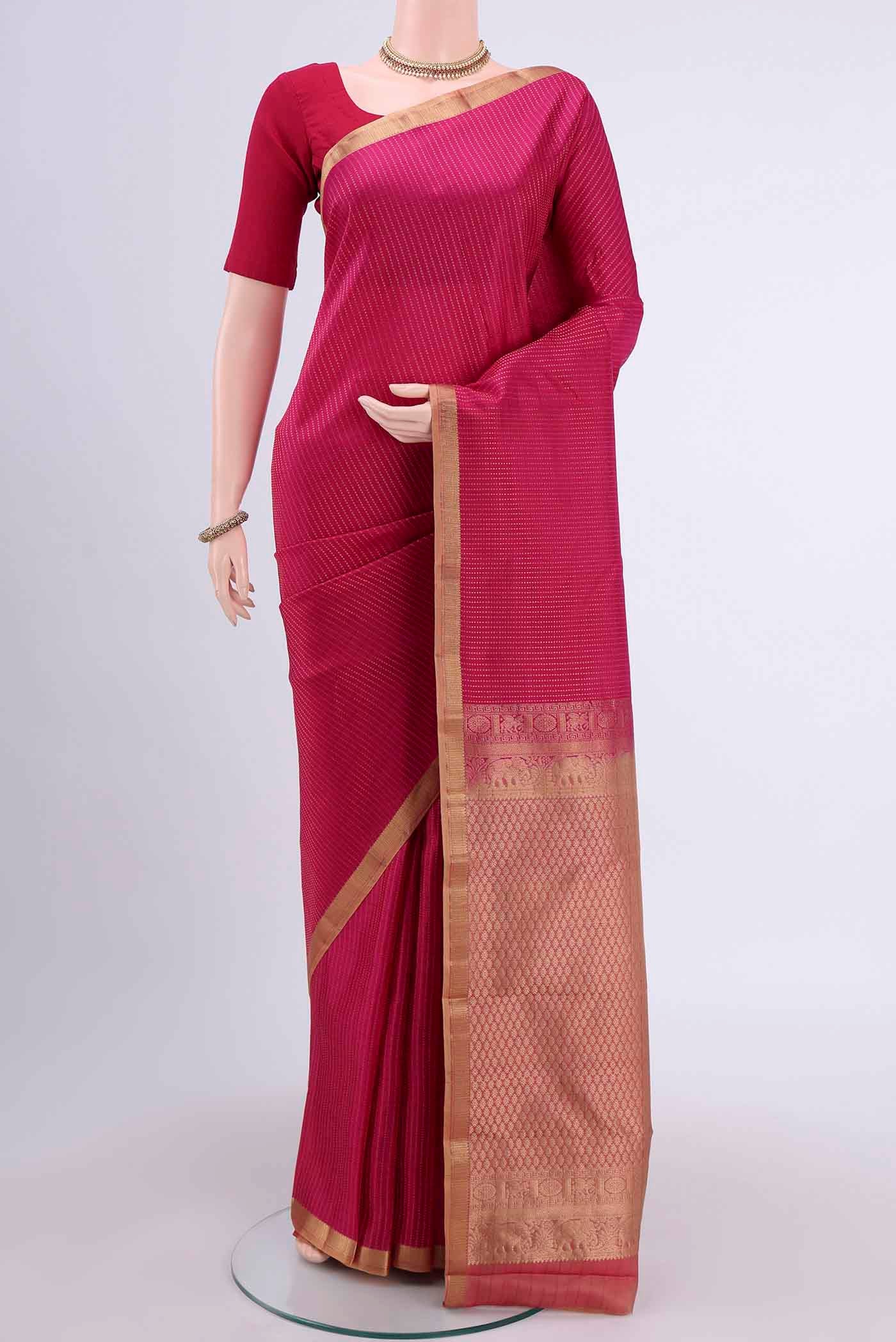 Rani Pink Dual Tone Nangavalli Silk [ Salem ] Saree with Stripes on the body and Zari Border displayed on a mannequin