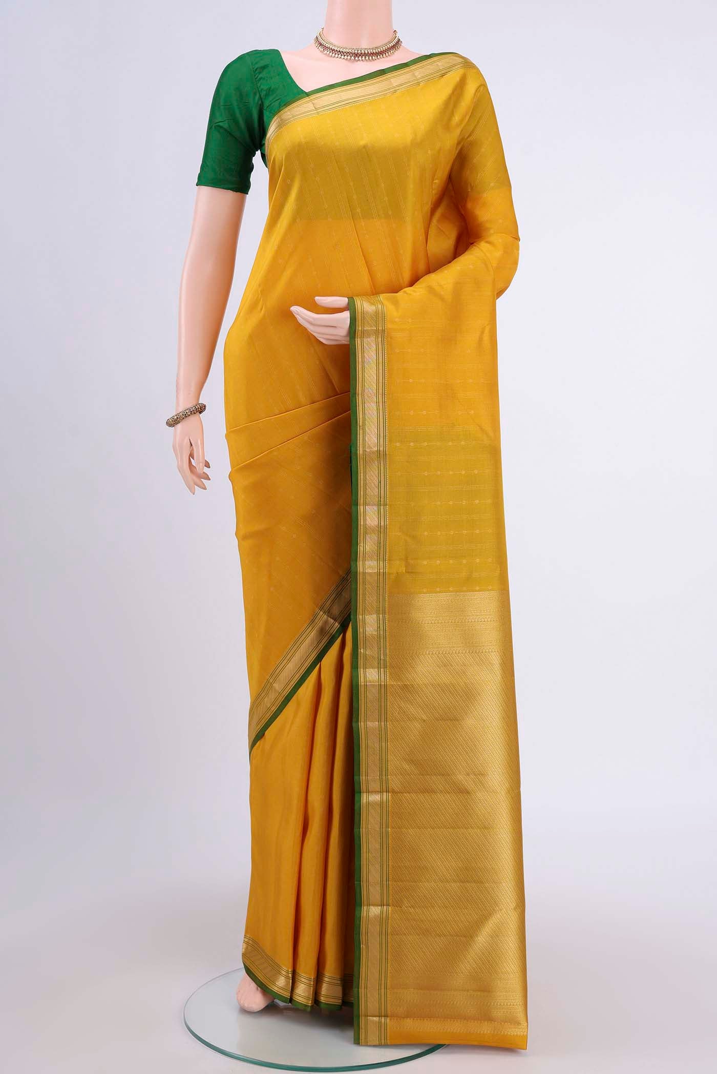 Lemon Yellow Dual Tone Nangavalli Silk [ Salem ] Saree with Stripes on the body and Zari Border displayed on a mannequin