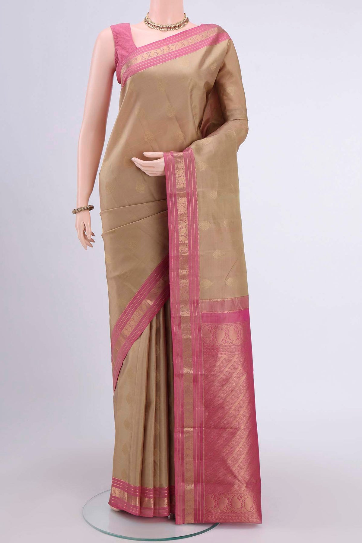 Dark Beige Dual Tone Nangavalli Silk [ Salem ] Saree with Zari Butta on the body and Zari Border displayed on a mannequin