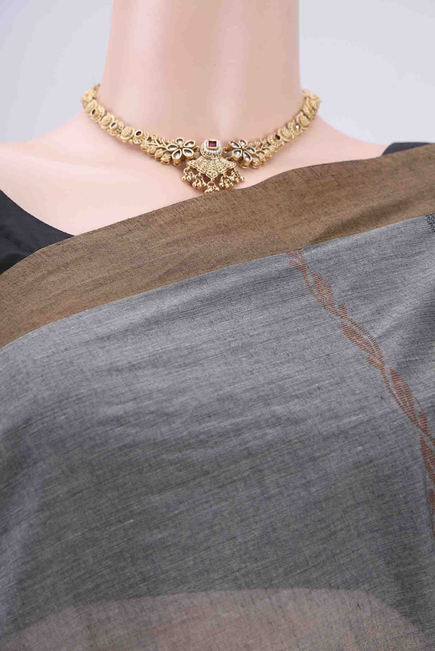 Border image of Grey Kanchi Cotton Saree with Stripes on the body and Thread Border. 