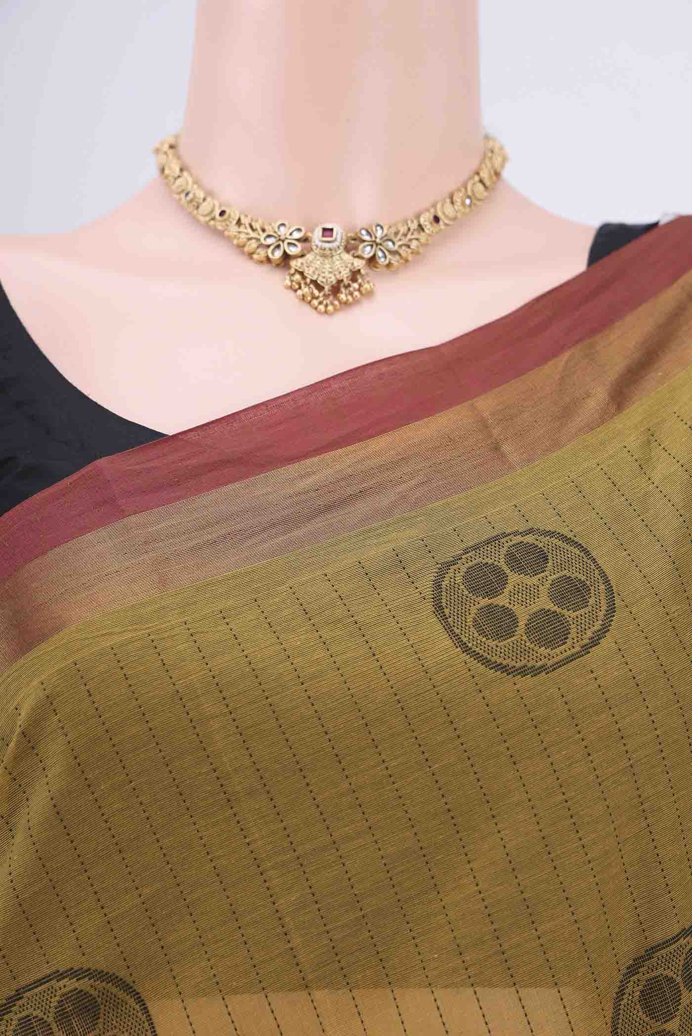 Border image of Mustard Kanchi Cotton Saree with Stripes on the body and Zari Border. 