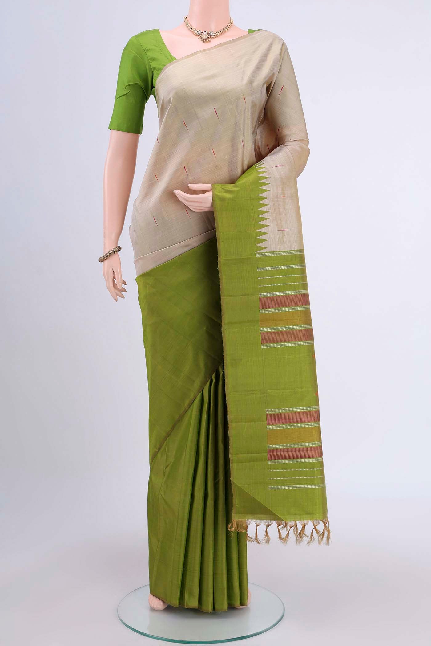 Dark Beige Kanchipuram Saree with Thread Butta on the body and Temple Border displayed on a mannequin