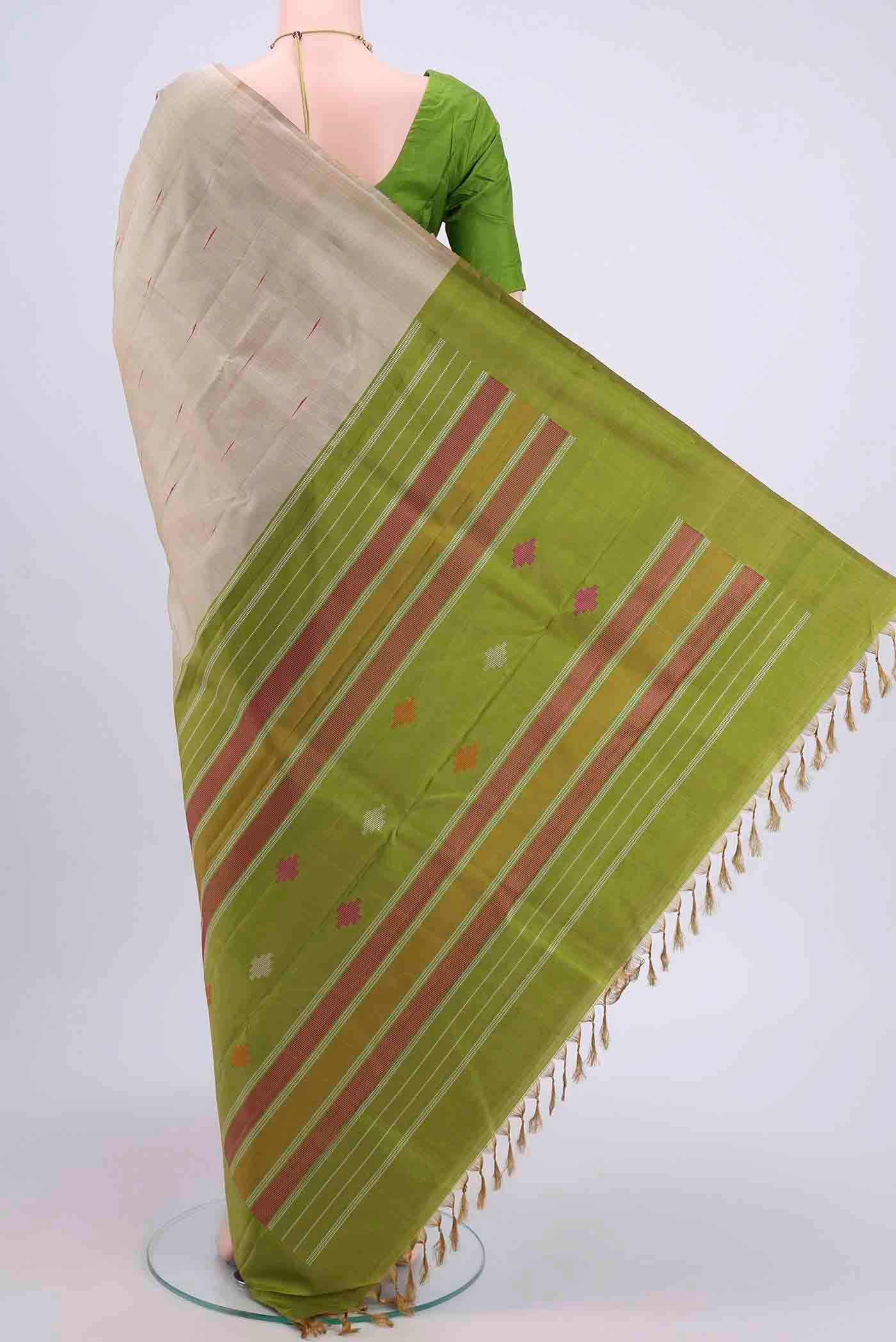 Flat view of Dark Beige Kanchipuram Saree with Thread Butta on the body and Temple Border