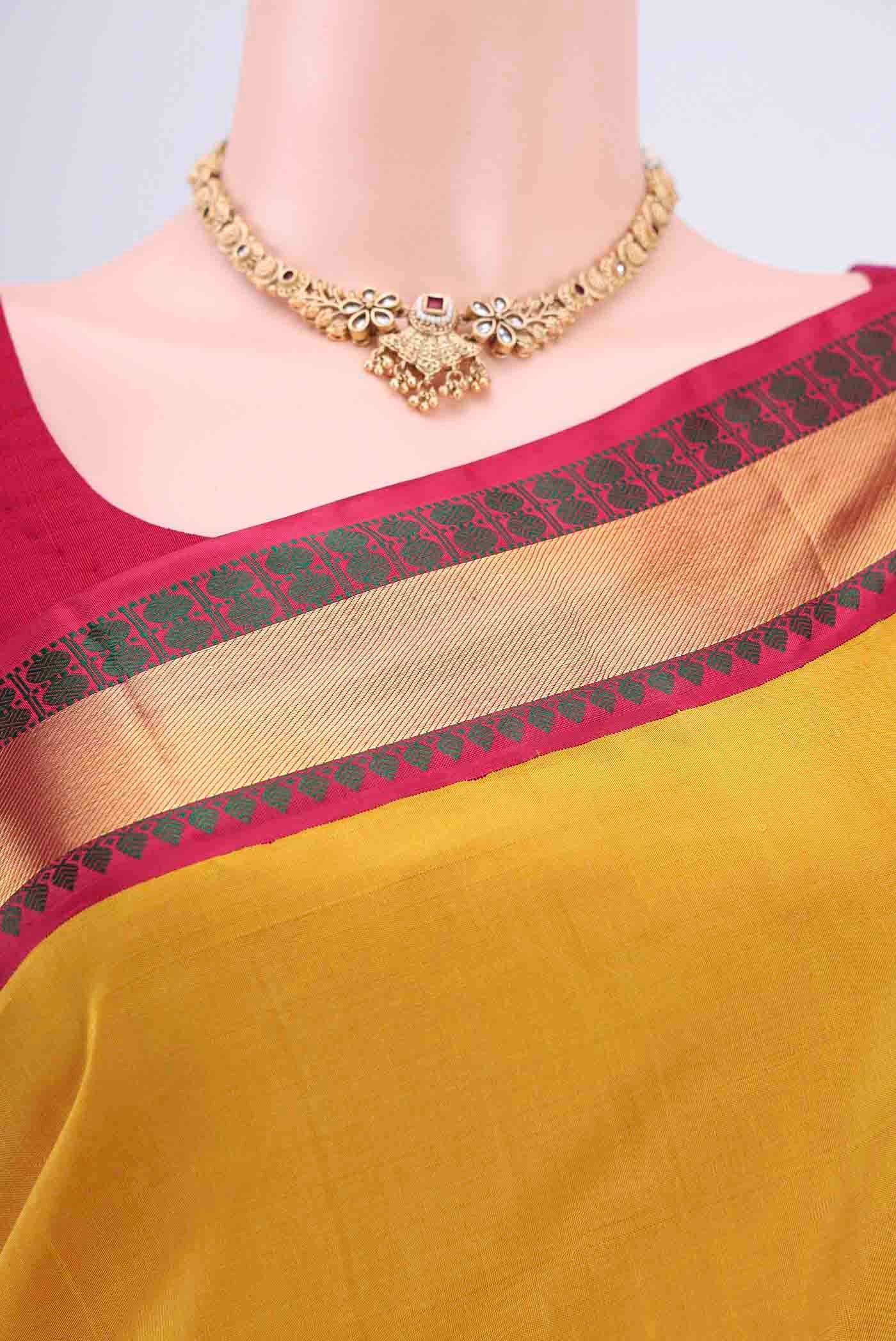 Border image of Yellow Kanjivaram Saree with Plain Body and Zari Border. 