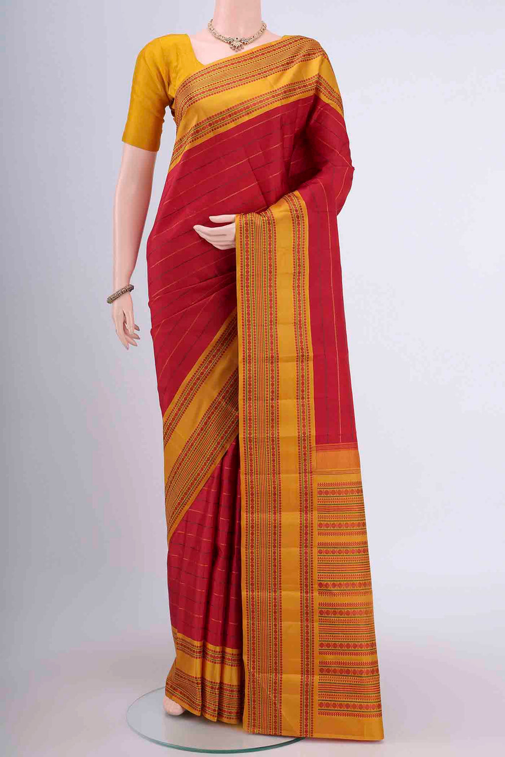 Red Dual Tone Kanchipuram Saree with Stripes on the body and Thread Border displayed on a mannequin