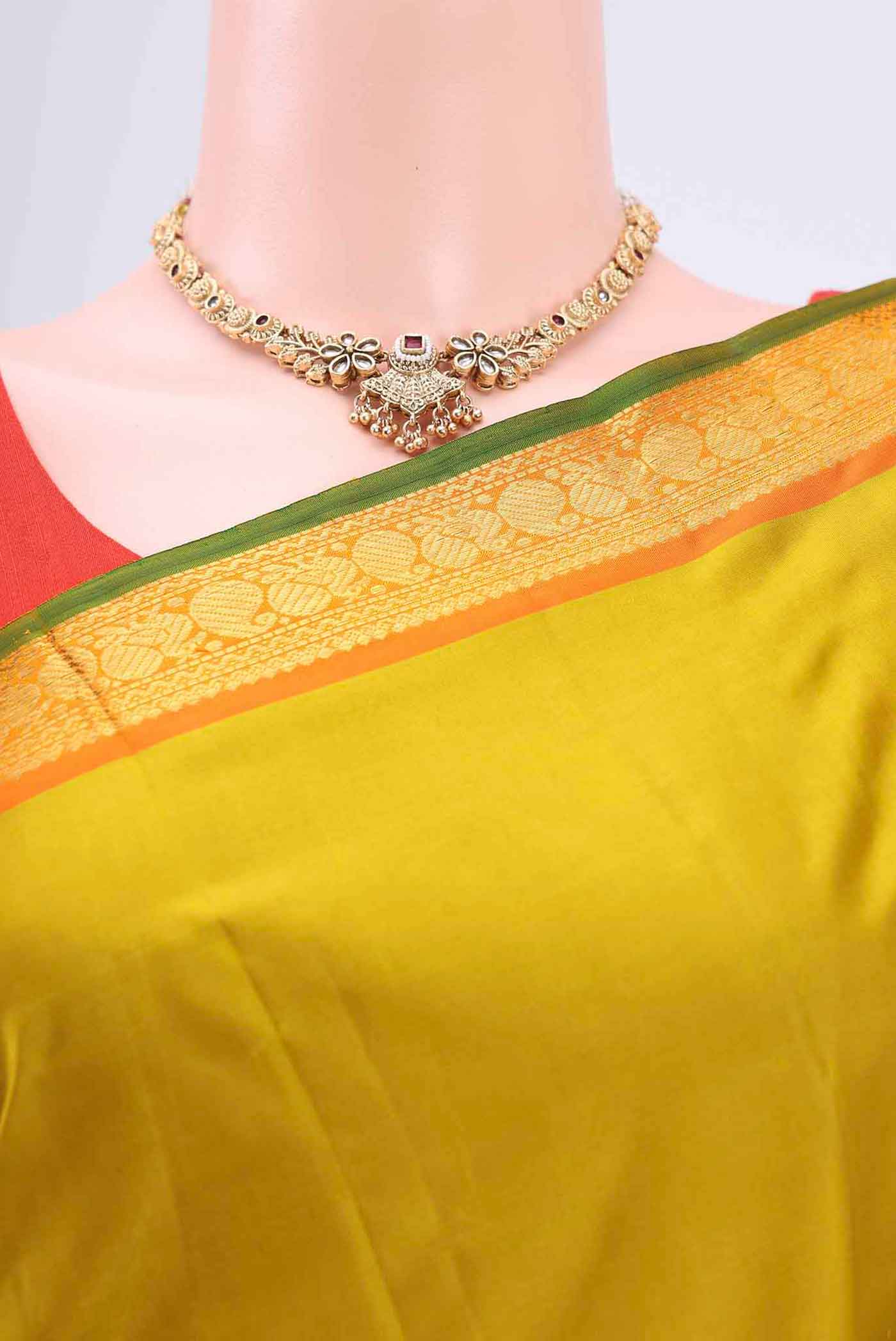 Border image of Acid Green Kanchipuram Saree with Plain Body and Zari Border