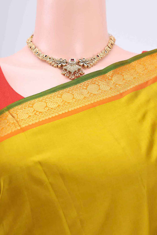 Border image of Acid Green Kanchipuram Saree with Plain Body and Zari Border