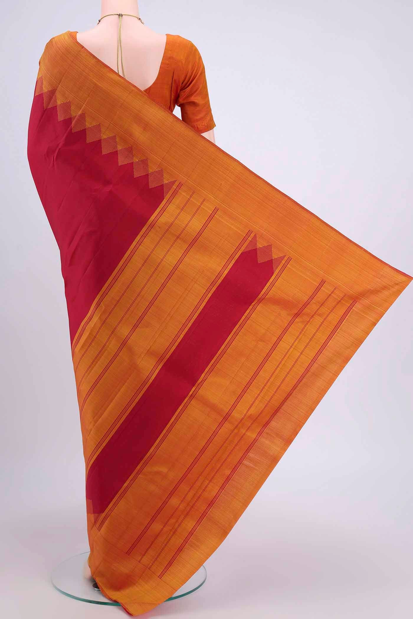 Flat view of Maroon Kanchipuram Saree with Plain Body and Temple Border