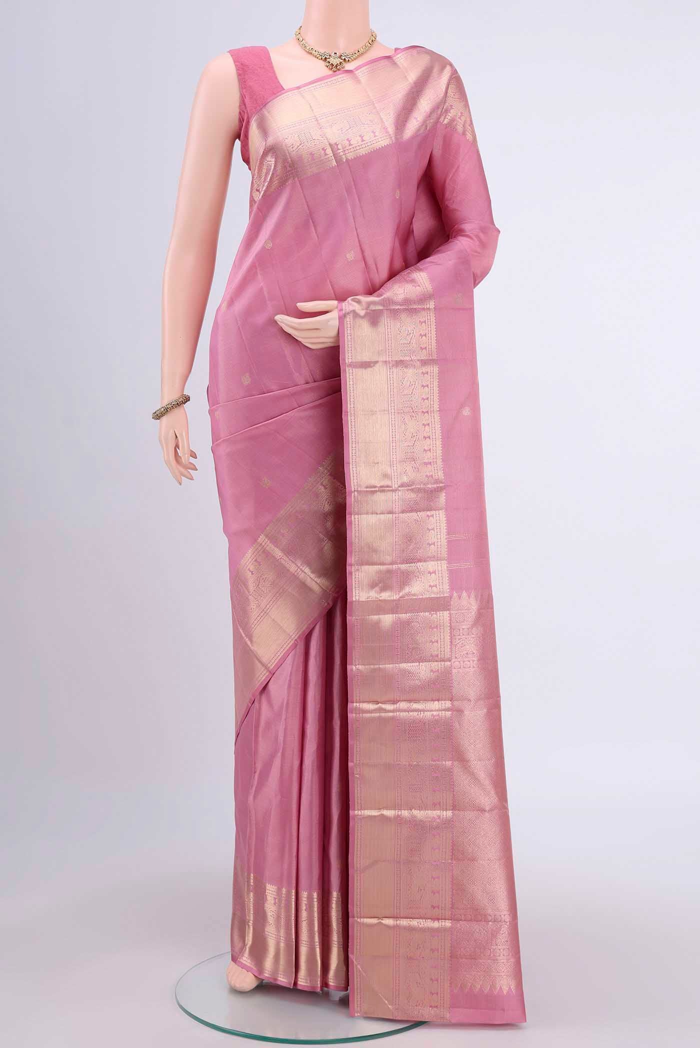 Rose pink Dual Tone Kanchipuram Saree with Zari Brocade on the body and Zari Border displayed on a mannequin
