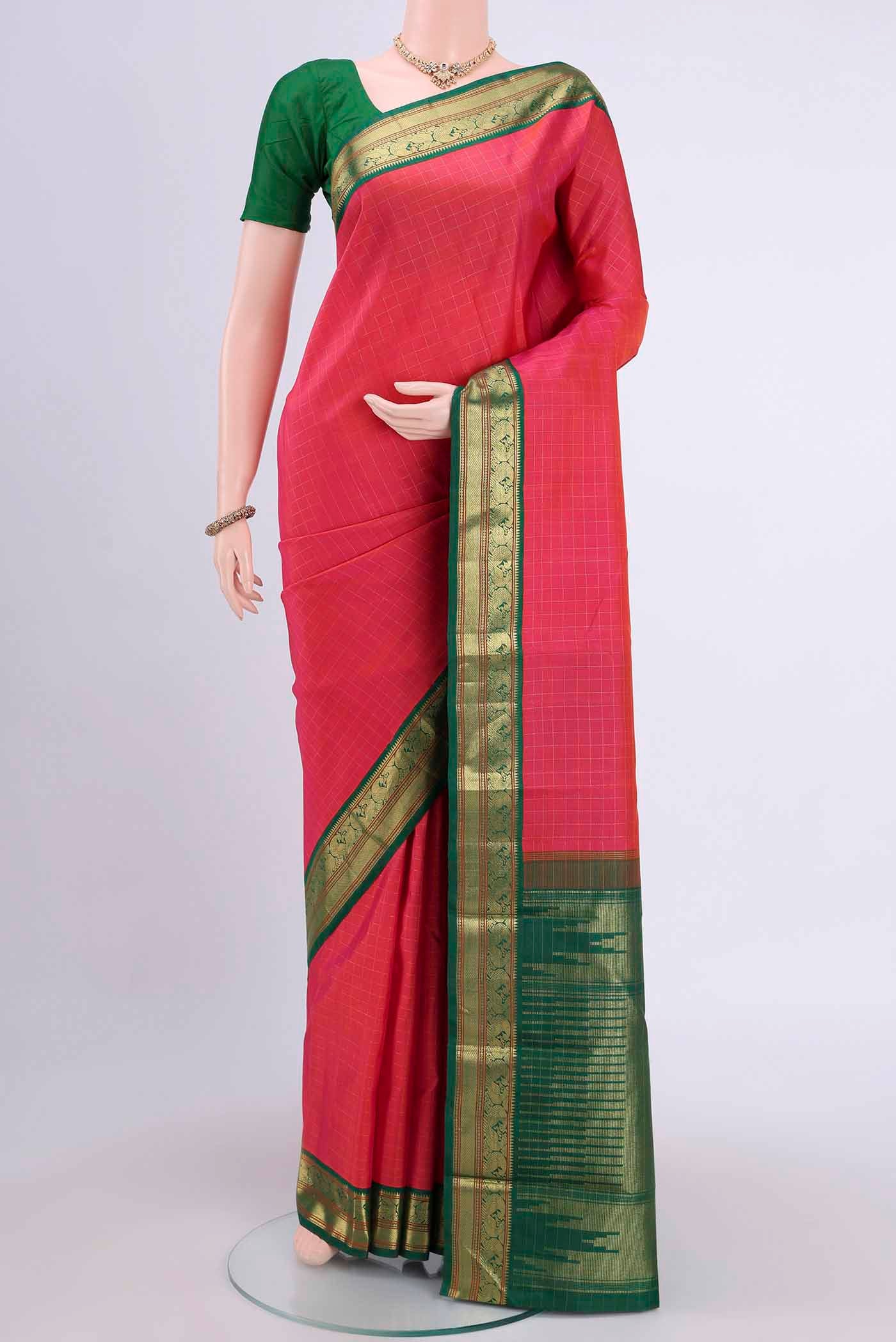 Dark Pink Kanchipuram Saree with Checked design on the body and Zari Border displayed on a mannequin