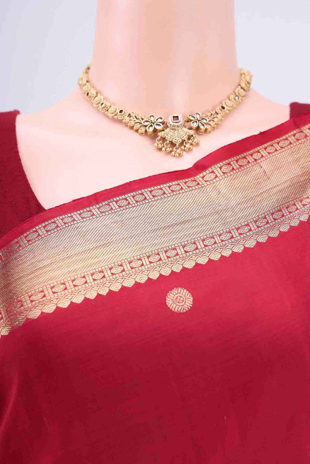 Border image of Maroon Kanjivaram Saree with Zari Butta on the body and Zari Border. 