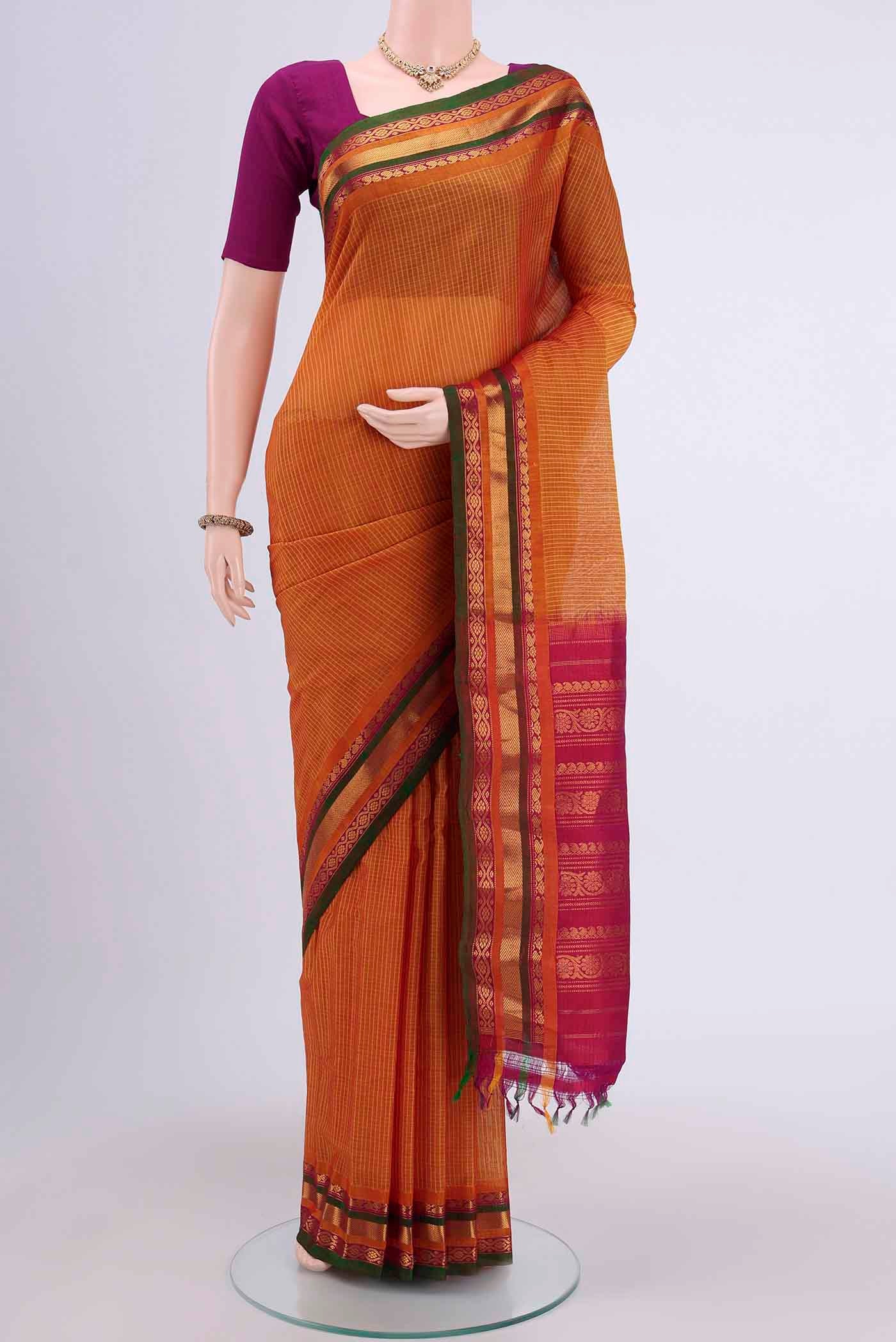 Yellow Gadwal Silk Saree with Stripes on the body and Zari Border displayed on a mannequin
