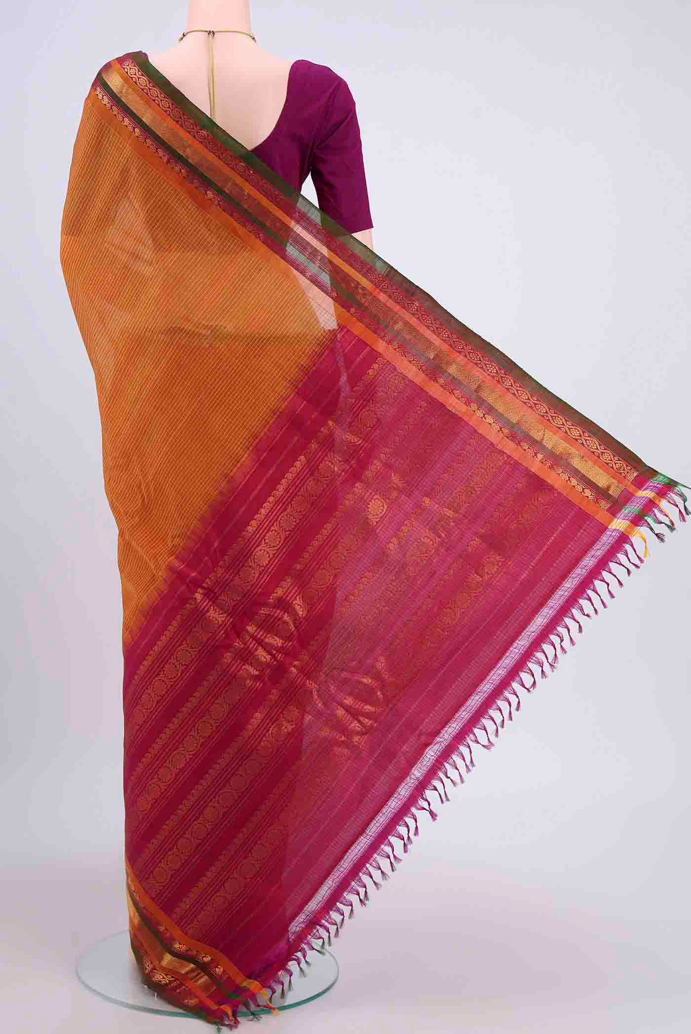 Flat view of Yellow Gadwal Silk Saree with Stripes on the body and Zari Border