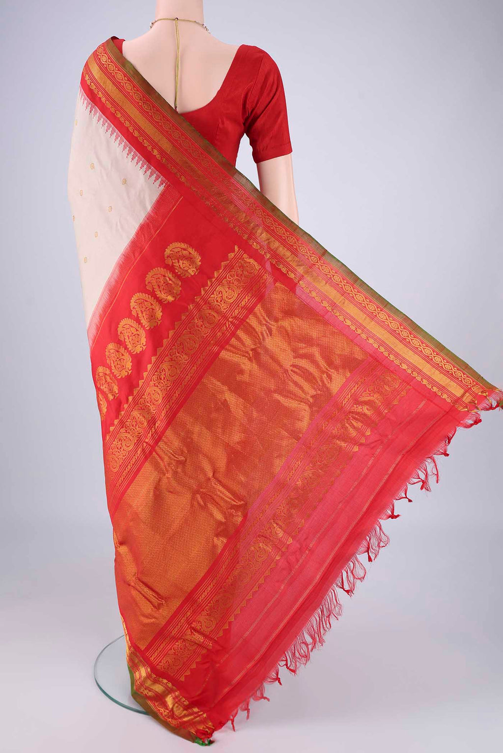 Flat view of Beige Gadwal Silk Saree with Zari Butta on the body and Zari Border. 