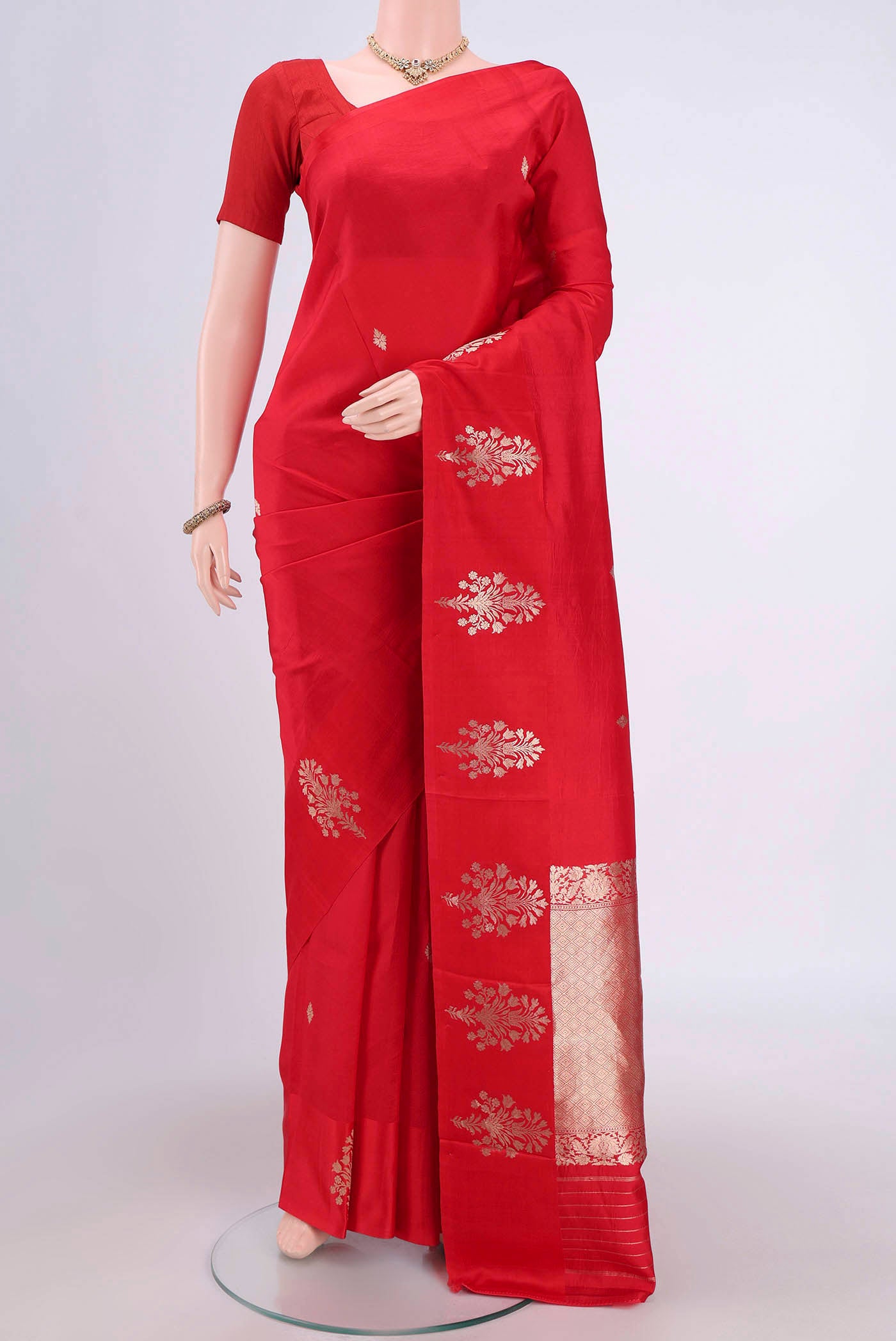 Red Banarasi Katan Silk Saree with Zari Butta on the body and Zari Border.  displayed on a mannequin